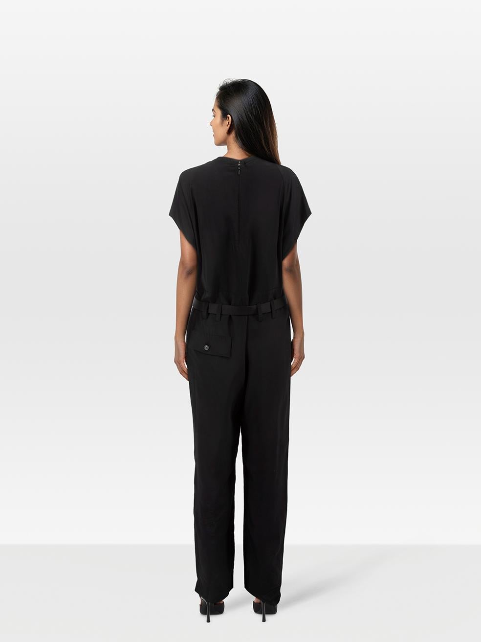 CONDITION is Very good. Minimal wear to jumpsuit is evident. Minimal wear to the right internal armpit with loose stitching on this used Prada designer resale item.
 
 
 
 Details
 
 
 Black
 
 Viscose
 
 Jumpsuit
 
 Short sleeves
 
 Belted
 
 Back,