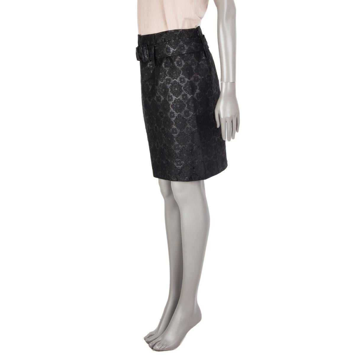 Prada brocade straight skirt in black silk (59%), cotton (31%), and polyester (10%). With belt loops and matching belt. Closes with invisible zipper on the back side. Lined in black fabric. Has been worn and is in excellent condition. 

Tag Size