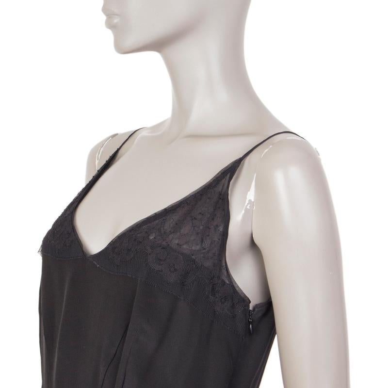 Prada spaghetti-strap dress in black silk (100%). WIth lace trims, v neck, and v back. Closes with hook and invisible zipper on the side. Lined in black cupro (73%) and silk (27%). Has been worn and is in excellent condition. 

Tag Size 40
Size