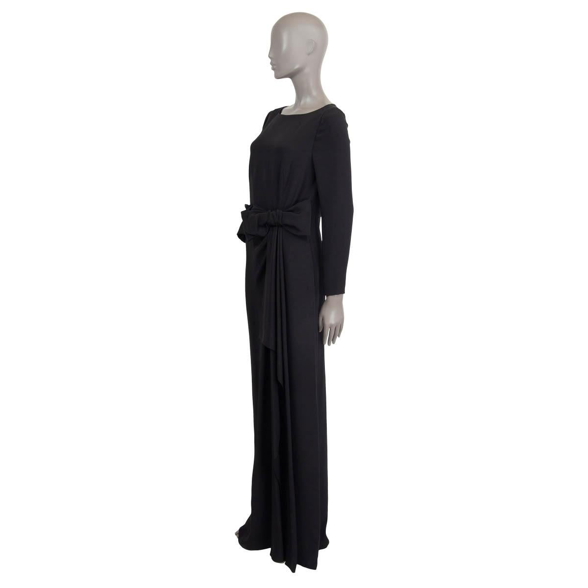 100% authentic Prada bow embellished maxi dress in black silk (100%). Features long sleeves, zipped cuffs and a slit at the front. Opens with a concealed zipper and a hook at the back. Lined in black cupro (60%) and silk (40%). Brand new, with