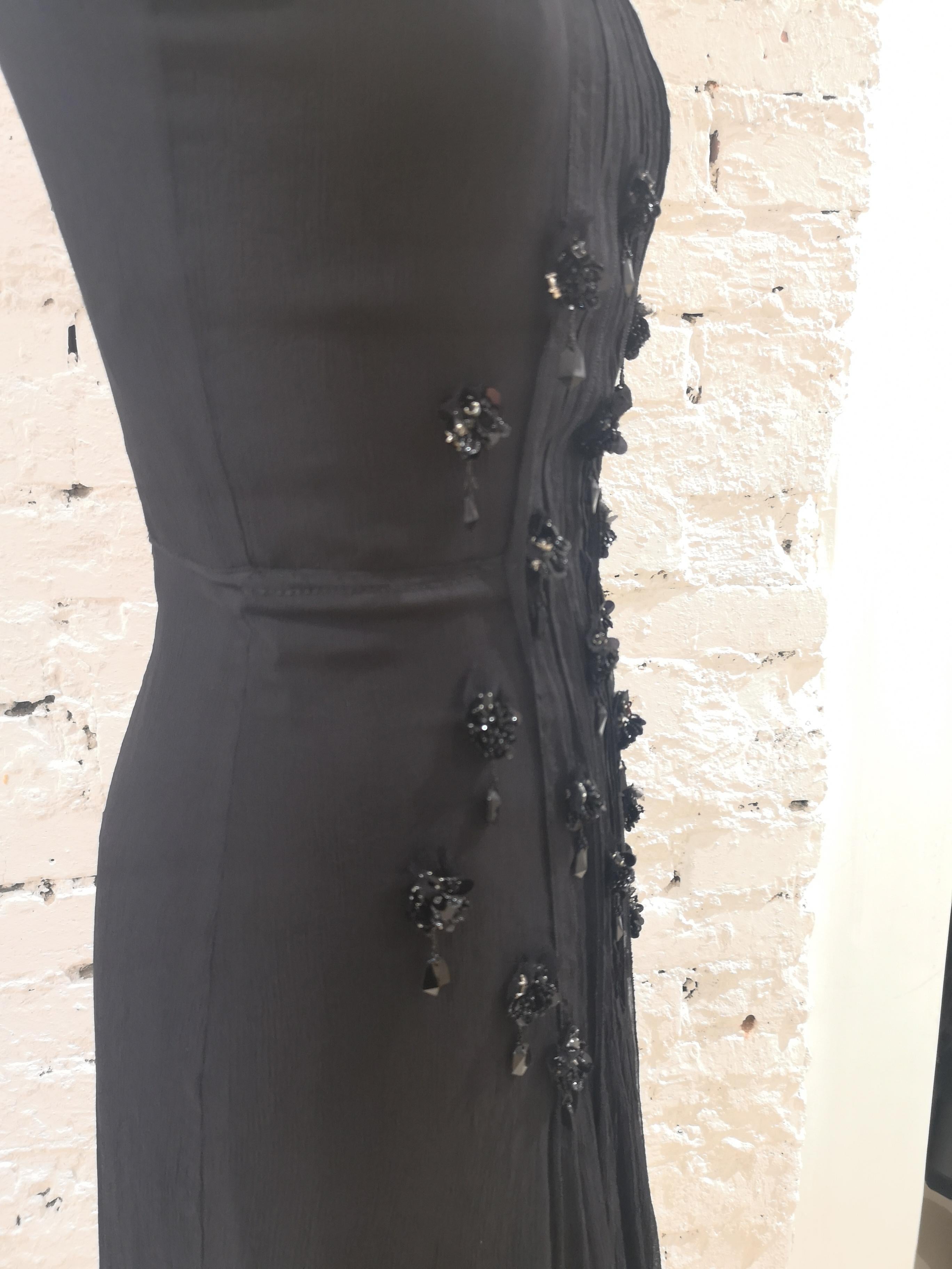 Prada Black silk with swarovsky stones Dress
PRada black dress embellished with black swarovski studs on the front and all around the neck
size S 