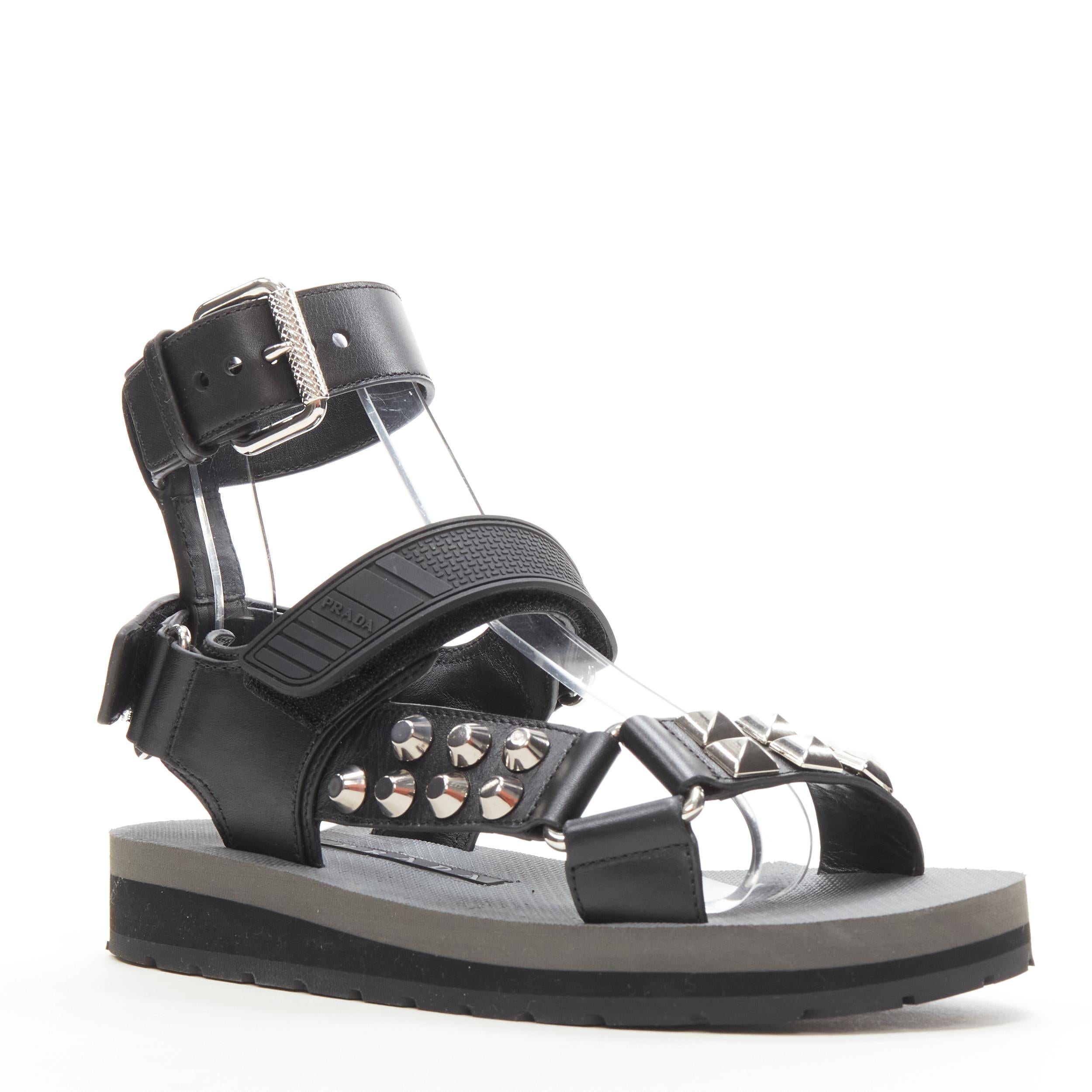 PRADA black silver punk stud embellished sports strap gladiator sandals EU36 
Reference: ANWU/A00364 
Brand: Prada 
Designer: Miuccia Prada 
Material: Leather 
Color: Black 
Pattern: Solid 
Closure: Magic Tape 


CONDITION: 
Condition: Excellent,