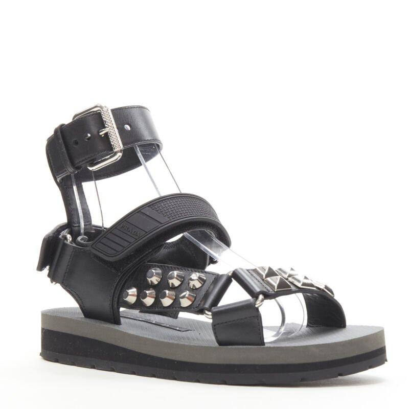 PRADA black silver punk stud embellished sports strap gladiator sandals EU36
Reference: ANWU/A00364
Brand: Prada
Designer: Miuccia Prada
Material: Leather, Rubber
Color: Black, Silver
Pattern: Solid
Closure: Magic Tape

CONDITION:
Condition: