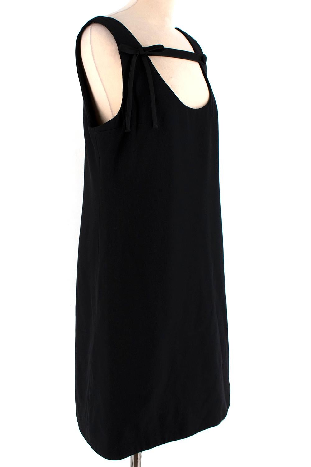 Prada Black Sleeveless Mini Dress with Bow 

-From the 2019 Spring collection 
-Sleeveless classic design 
-Inspired by the 60's 
-Satin strap detail to the neckline with a button fastening 
-Bow detail to the shoulder
-Zip fastening to the