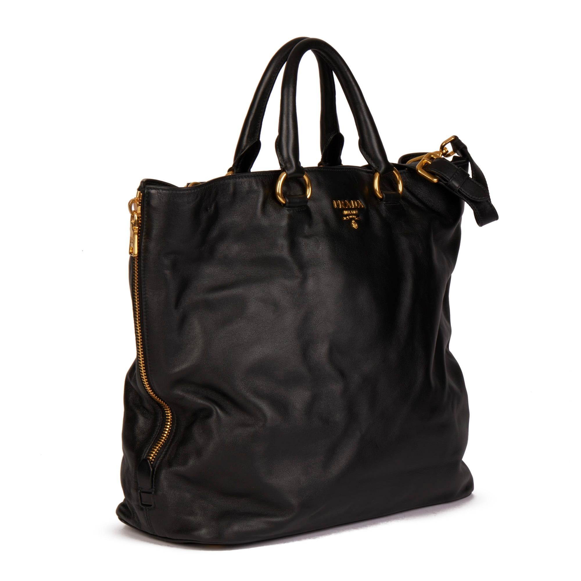 PRADA
Black Soft Calf Leather Tote Bag

Serial Number: 204
Age (Circa): 2000
Accompanied By: Prada Dust Bag, Care Booklet, Authenticity Card, Luggage Tag, Shoulder Strap
Authenticity Details: Date Stamp (Made in Italy)
Gender: Ladies
Type: Tote,