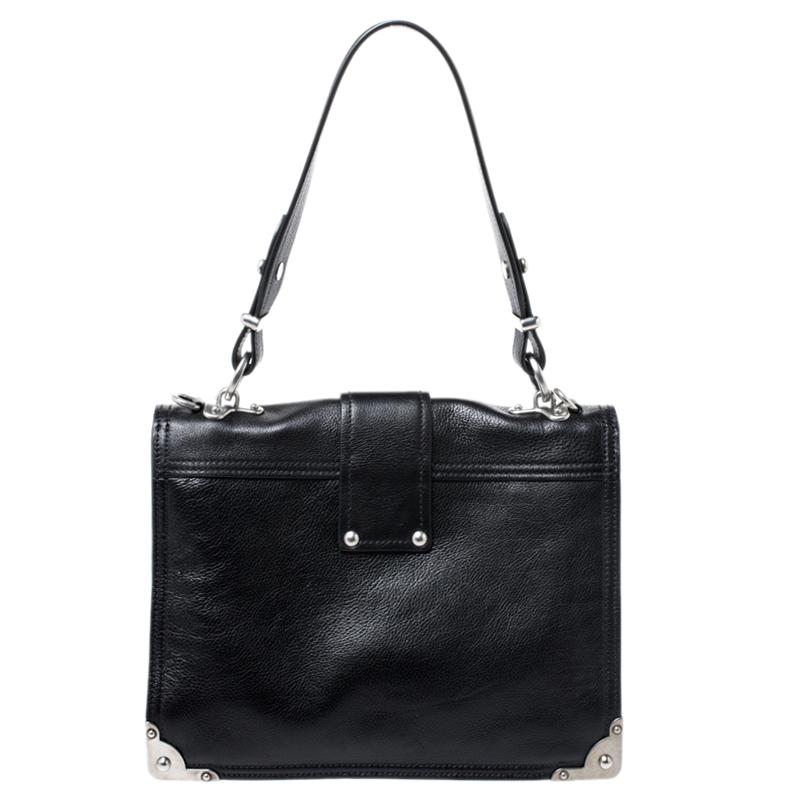 This stunning Cahier bag exhibits sophisticated craftsmanship which is evident in all Prada designs. Crafted from black leather, the bag features a shoulder strap and a sturdy silhouette. It is accented with silver-tone hardware and flaunts a