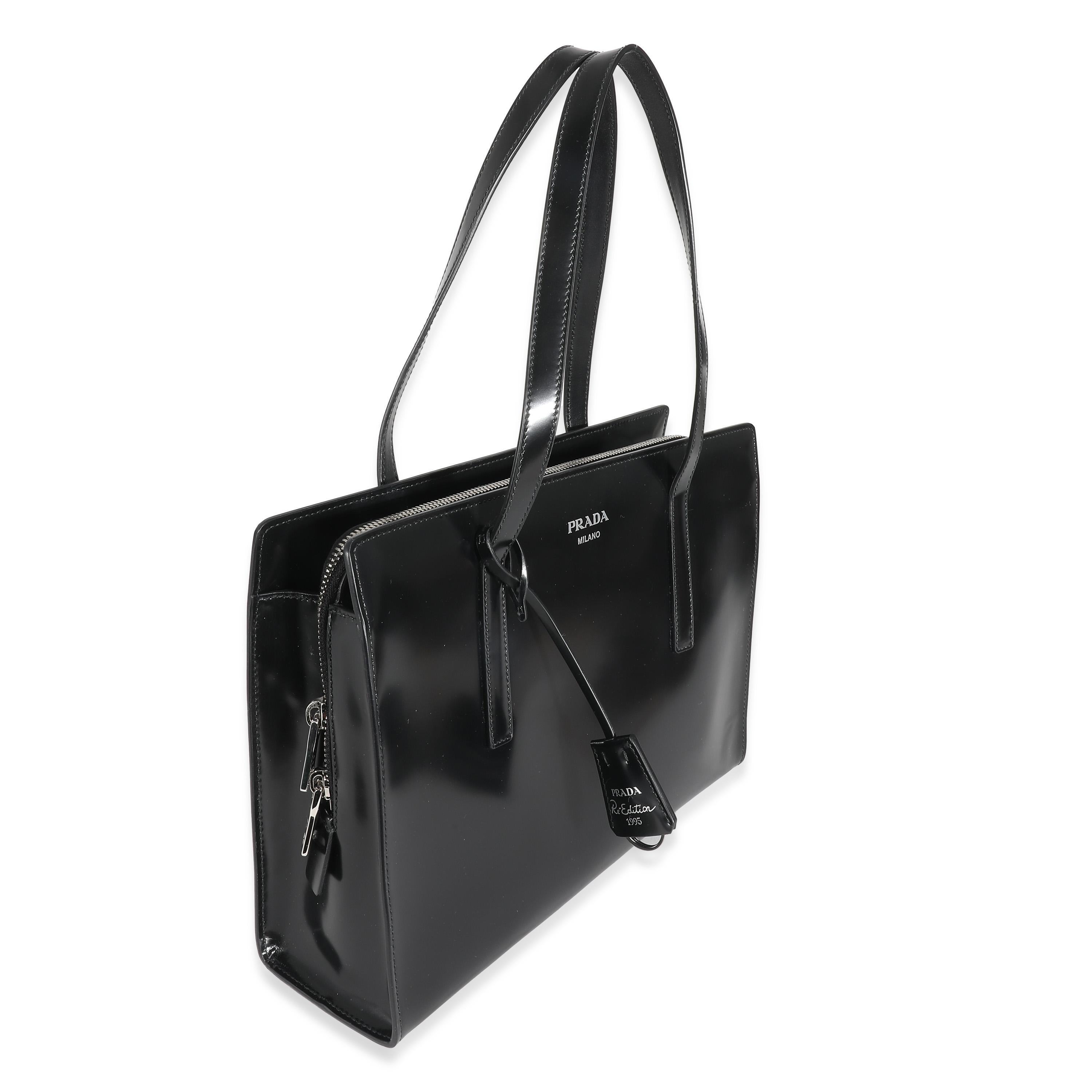 Listing Title: Prada Black Spazzolato Medium Re-Edition 1995
SKU: 134538
MSRP: 3800.00 USD
Condition: Pre-owned 
Handbag Condition: Excellent
Condition Comments: Item is in excellent condition and displays light signs of wear. Mild scuffing along