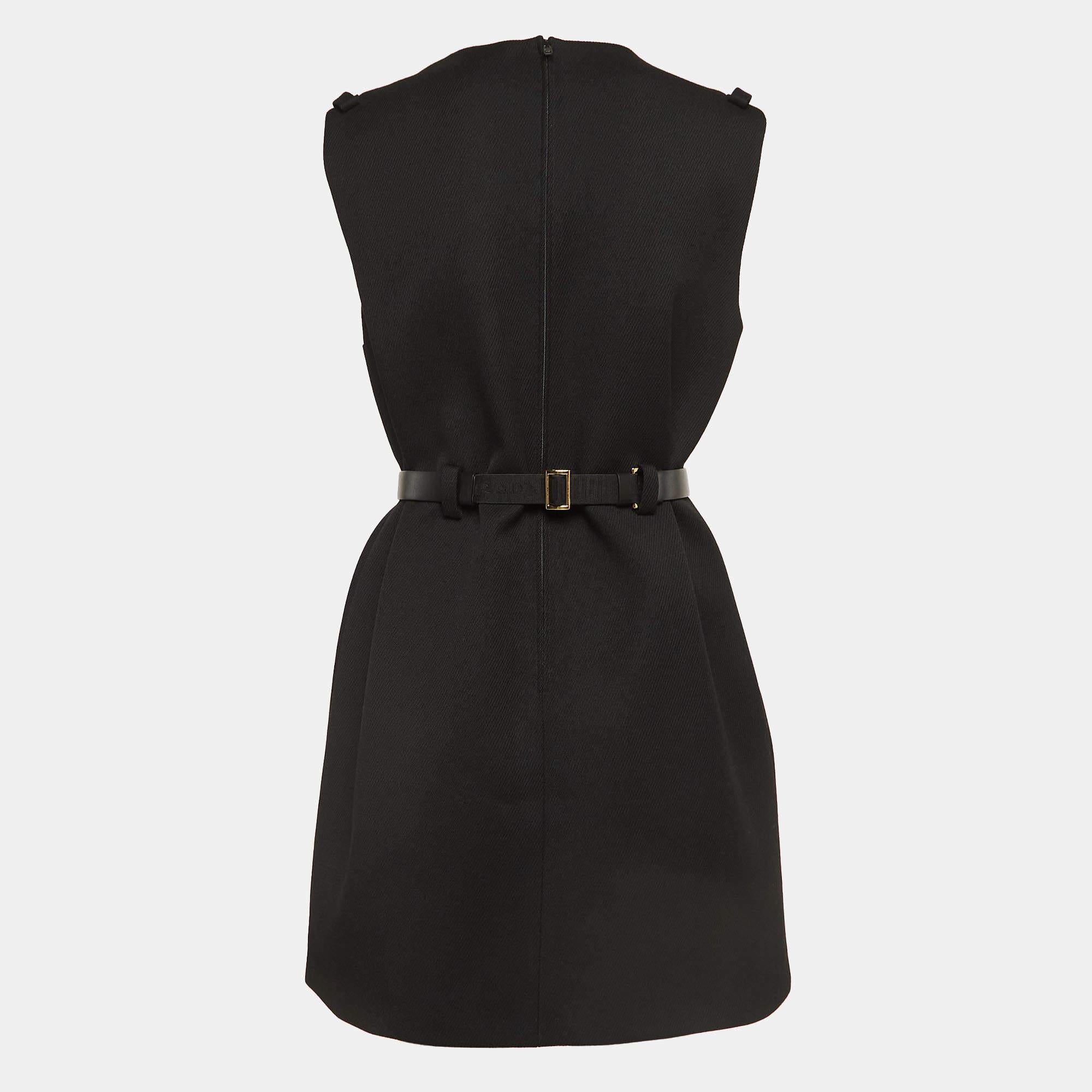 This Prada dress is a chic and stylish garment that exudes elegance and sophistication. With its sleek design, flattering silhouette, and high-quality craftsmanship, this dress is perfect for any special occasion or evening event, ensuring you stand