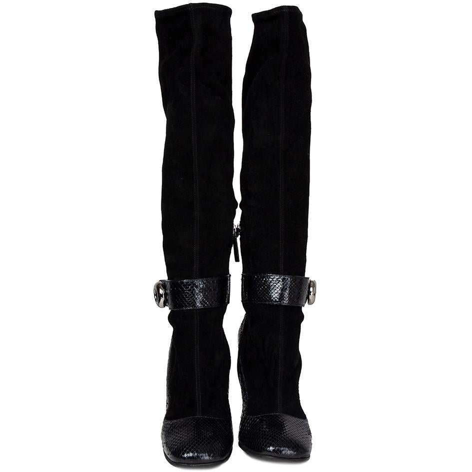 100% authentic Prada knee-high boots in black strechty suede with python and button buckle on the side. Have been worn and are in excellent condition. Black rubber soles have been added. 

Measurements
Imprinted Size	40
Shoe Size	40
Inside Sole	26cm