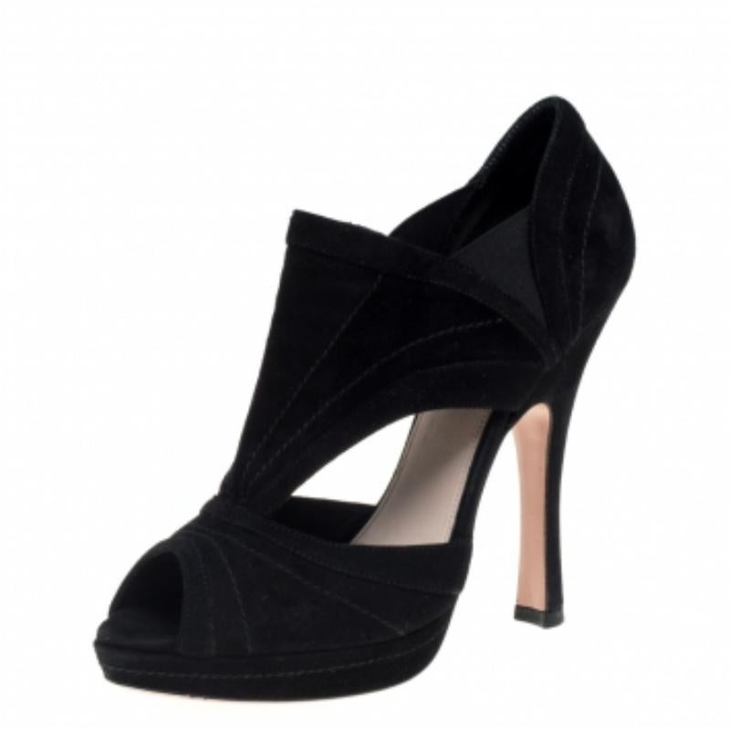 Wearing these stunning Prada booties will always be a joy, thanks to their fabulous construction! They are crafted from black suede and feature a peep-toe silhouette. They have been designed with cut-out detailed vamps and neat stitches that lend a