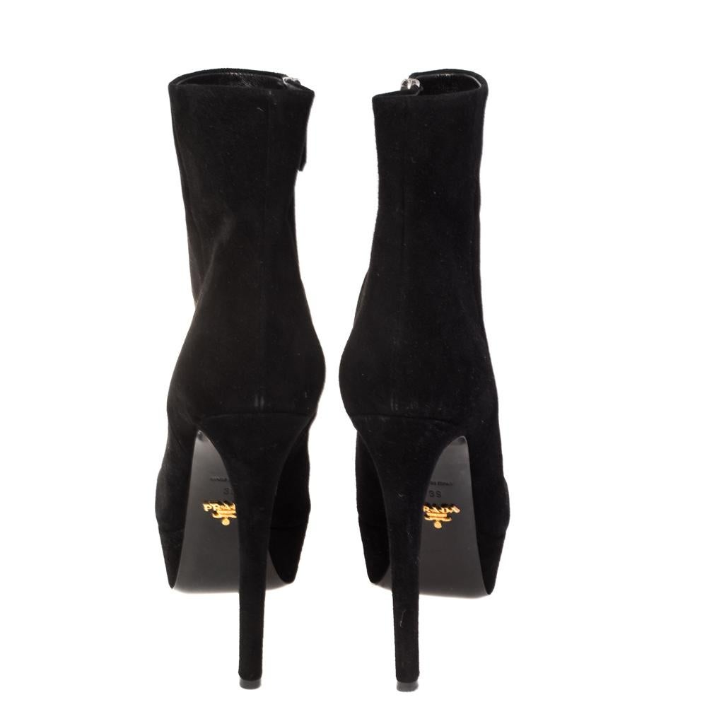 Create stylish and glamorous looks in an instant wearing these Prada ankle boots. Crafted in black suede, this beautiful pair of shoes features round toes with a platform front and sleek heels that won’t go unnoticed. Also featuring zip fastening on