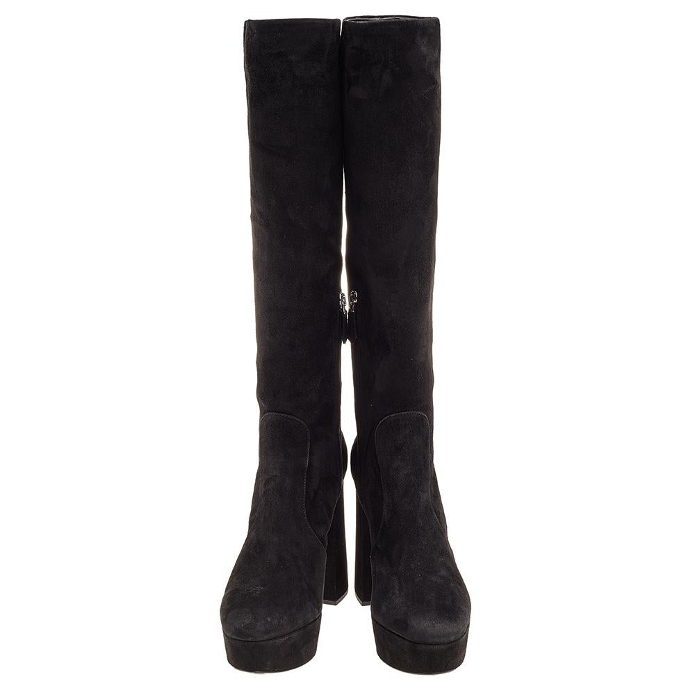 Give a glamorous yet elegant touch to your outfit with these knee-length boots from Prada. A black suede exterior, block heels, and leather insoles define this gorgeous pair.

Includes: Original Dustbag