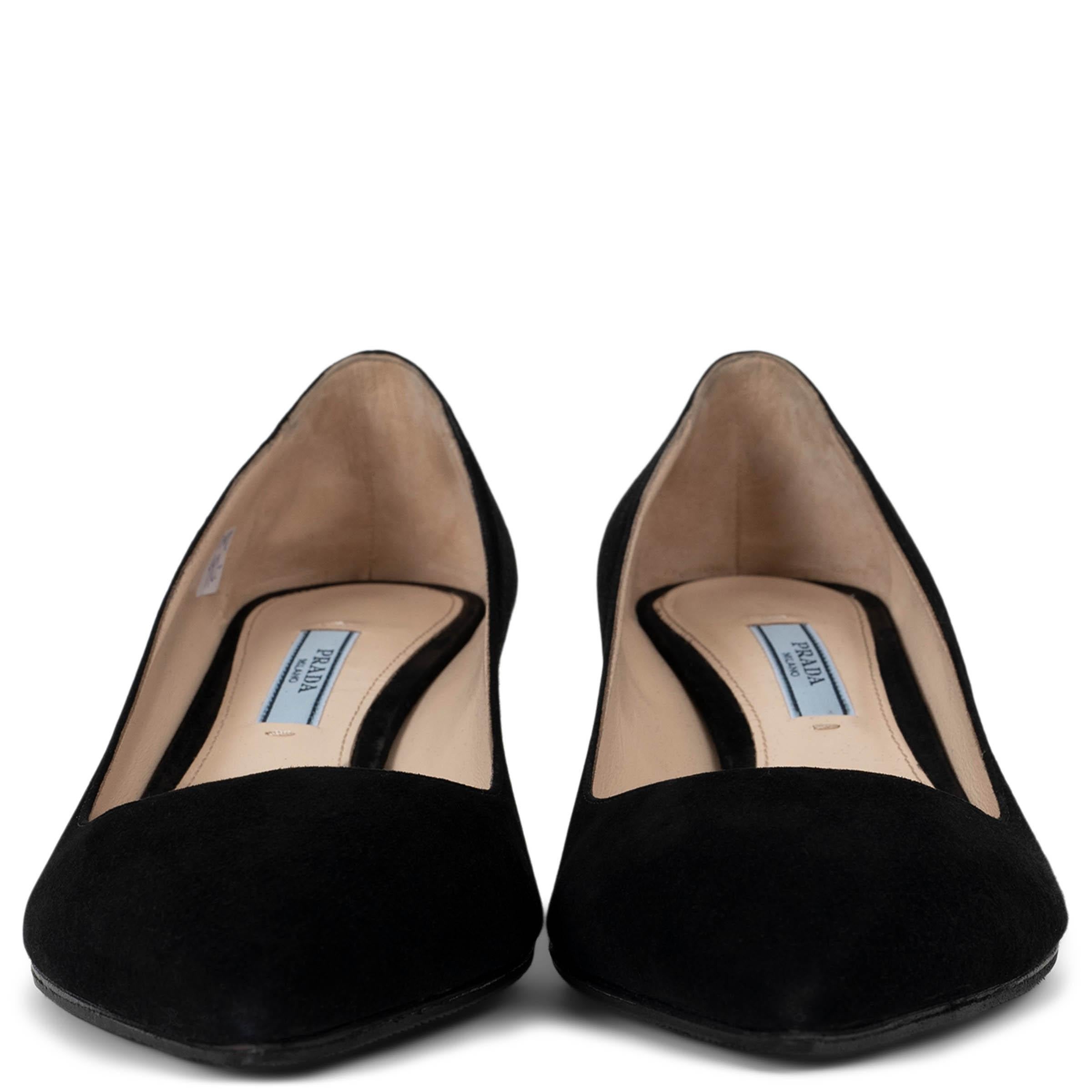 These 100% authentic Prada pointed-toe kitten-heel pumps are crafted from luxurious black suede. With a sleek silhouette and comfortable low heel, these pumps are the perfect blend of timeless elegance and everyday sophistication. Brand new. Black