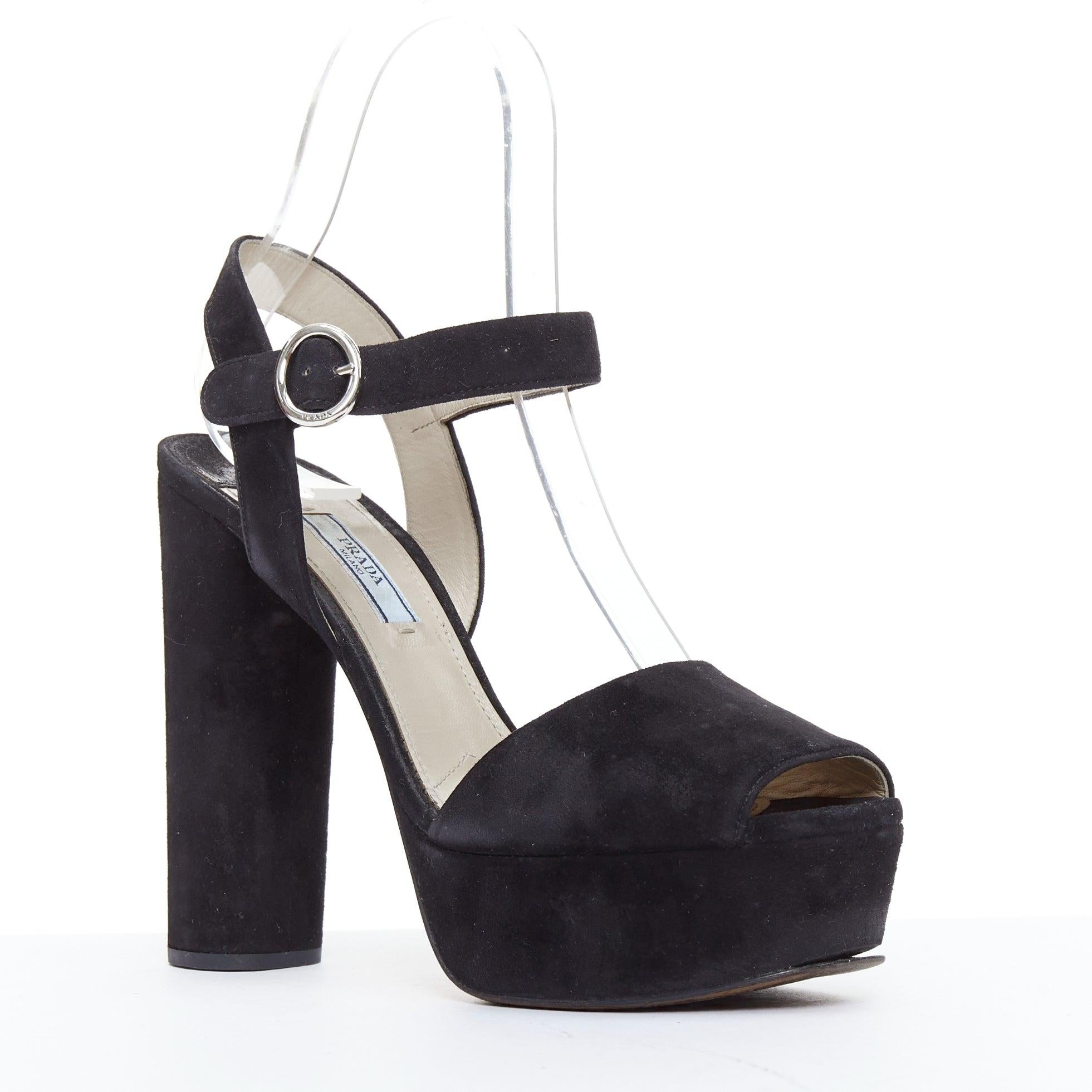 PRADA black suede round buckles peep toe chunky platform sandals EU39
Reference: PYCN/A00122
Brand: Prada
Designer: Miuccia Prada
Material: Leather
Color: Black, Silver
Pattern: Solid
Closure: Buckle
Lining: Nude Leather
Extra Details: Chunky