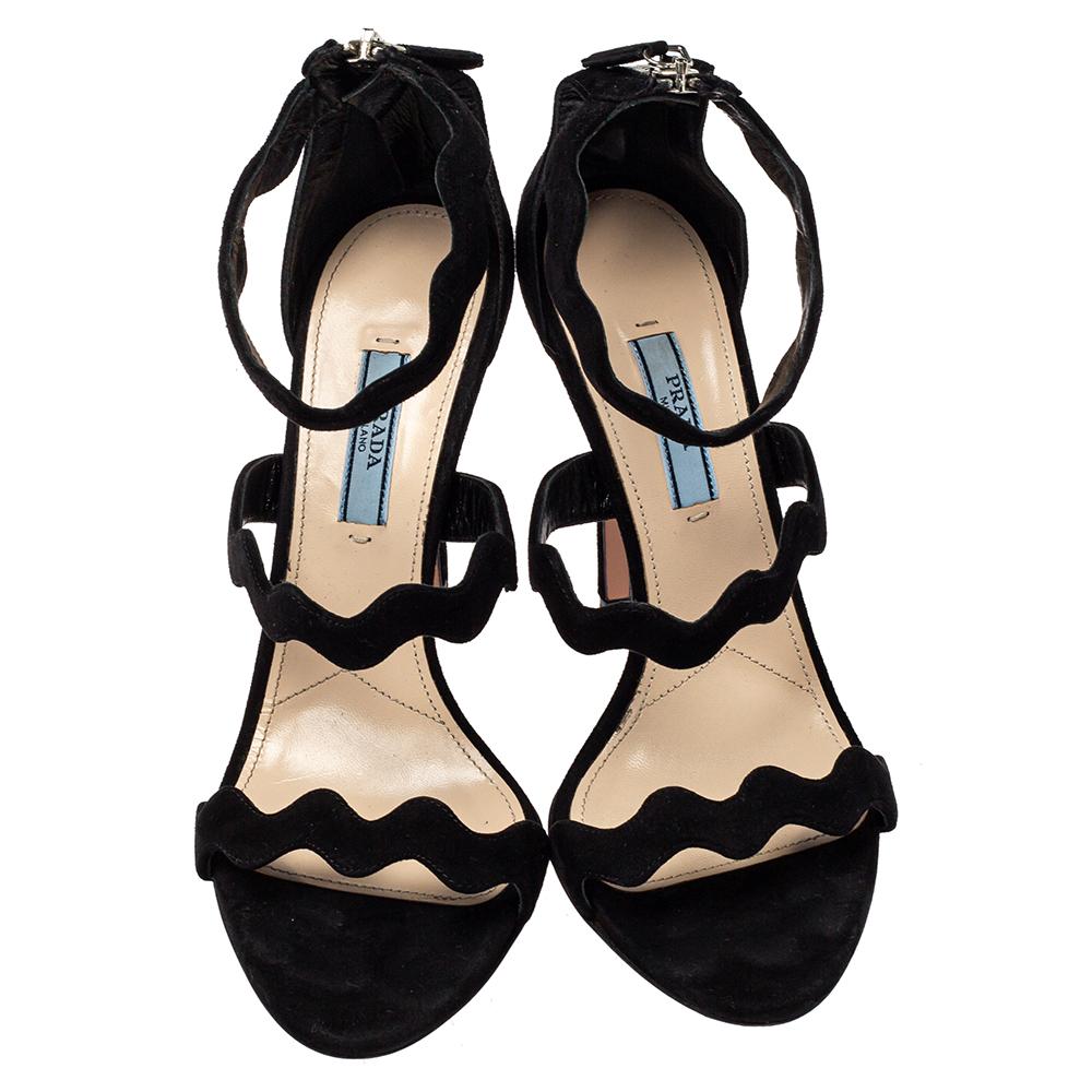 Prada is one of the leading names when it comes to a pair of gorgeous sandals like this one. These suede sandals are edgy, look fashionable and chic. These beauties are adorned with wavy straps that elegantly frame the foot.

Includes: Original