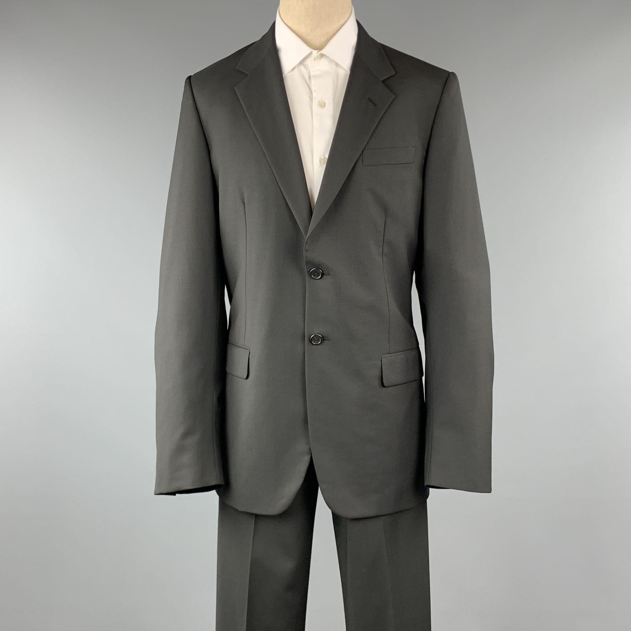PRADA suit comes in a black wool / mohair and includes a single breasted, 2 button sport coat with a notch lapel and matching front trousers. Made in Italy.

Excellent Pre-Owned Condition.
Marked: 52 L

Measurements:

-Jacket
Shoulder: 19 in.
Chest: