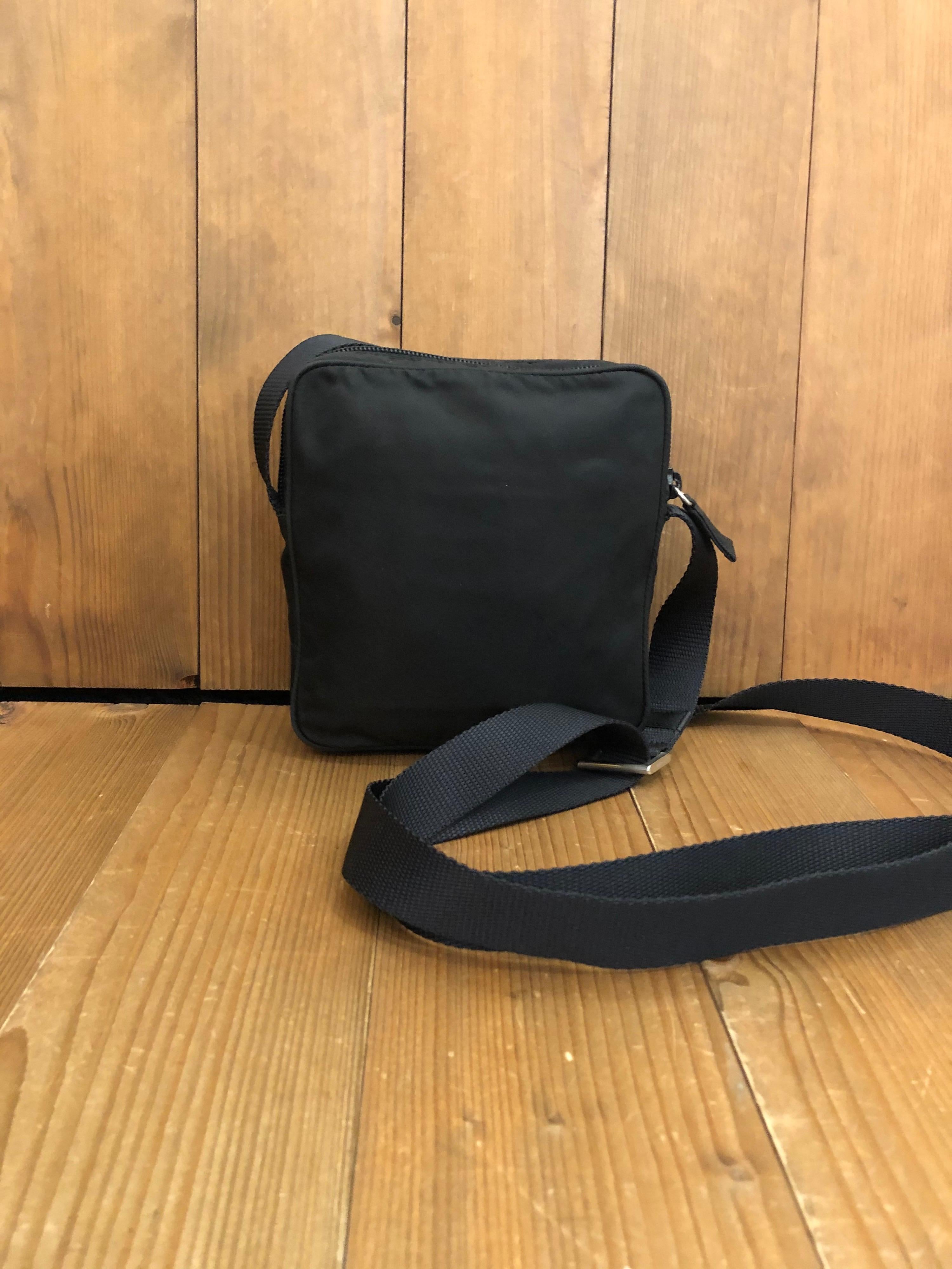 PRADA Black Tessuto Mini Crossbody Bag Unisex
Material: Polyester
Color: Black
Origin: Italy
Measurements: 5.9”x6.1”x1.5” Drop 28” (at its longest)
Specifications: 1 exterior zip pocket

Condition:
Outside: Minor marks
Inside: Clean
Pockets:
