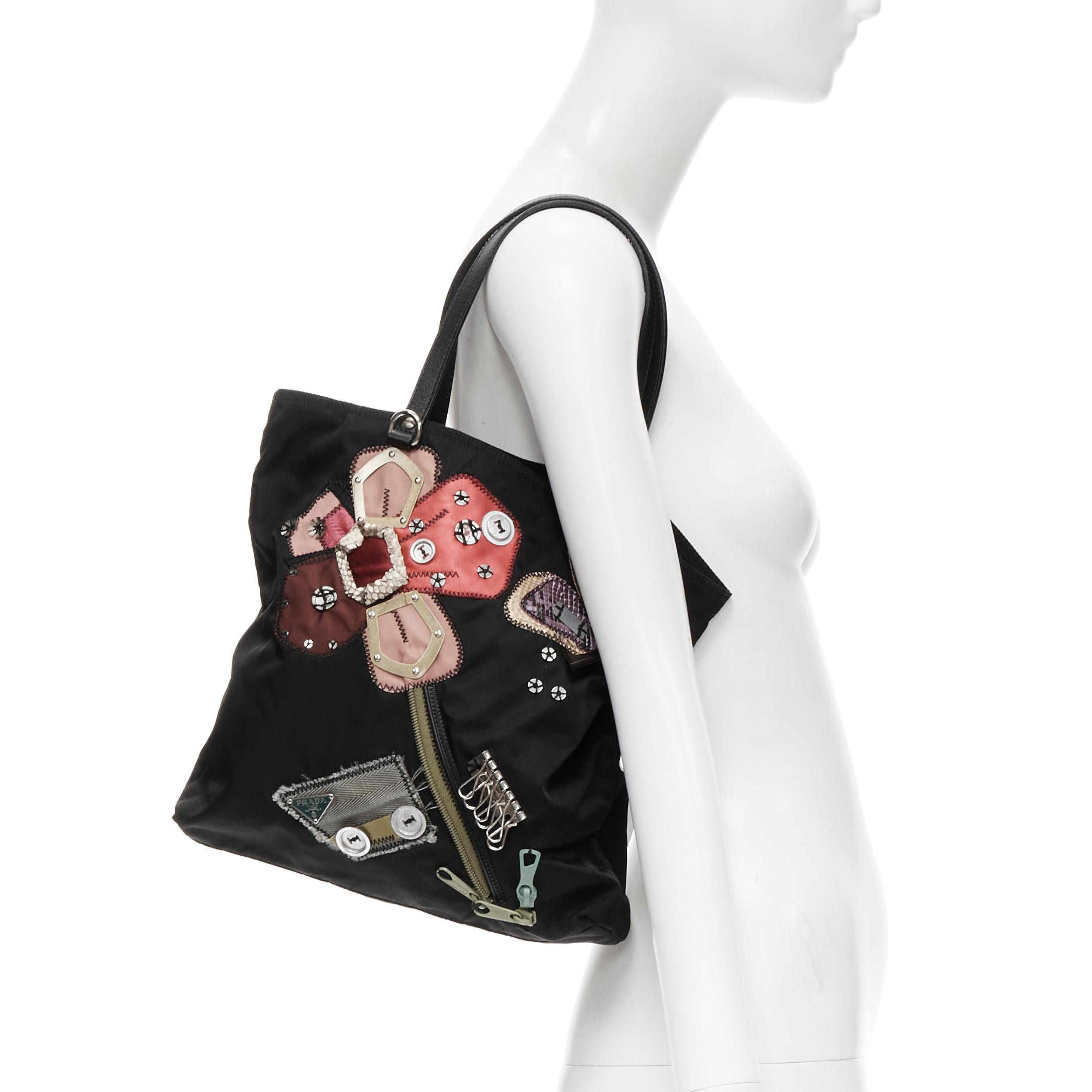 PRADA black Tessuto nylon floral patchwork bolts knit embellished tote bag \
Reference: CELG/A00010 
Brand: Prada 
Designer: Miuccia Prada 
Model: Floral patchwork tote 
Material: Nylon 
Color: Black 
Pattern: Floral 
Extra Detail: Inner zip pocket.