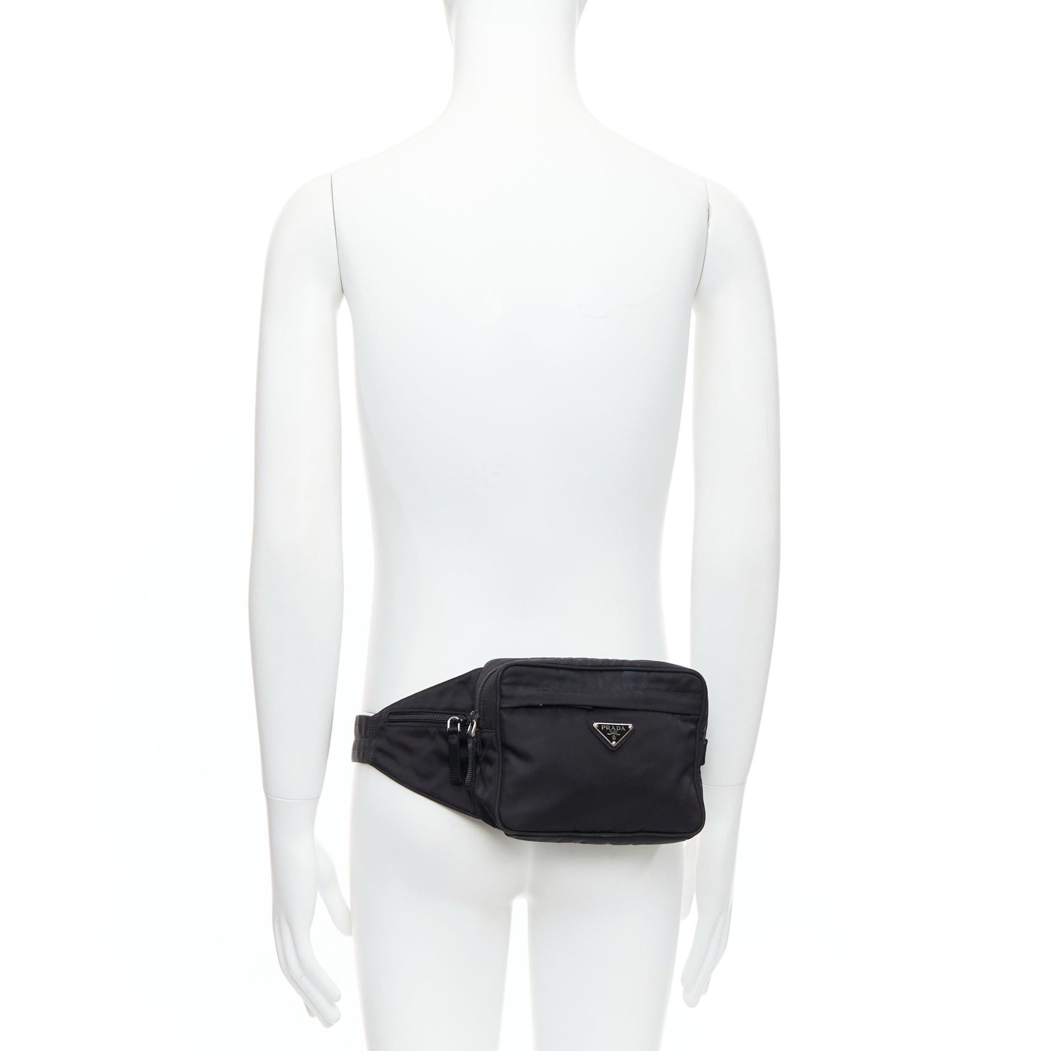 PRADA black tessuto nylon silver triangle plate crossbody waist bum bag
Reference: MLCO/A00034
Brand: Prada
Designer: Miuccia Prada
Material: Nylon
Color: Silver, Black
Pattern: Solid
Closure: Zip
Lining: Black Fabric
Extra Details: PRADA Tessuto
