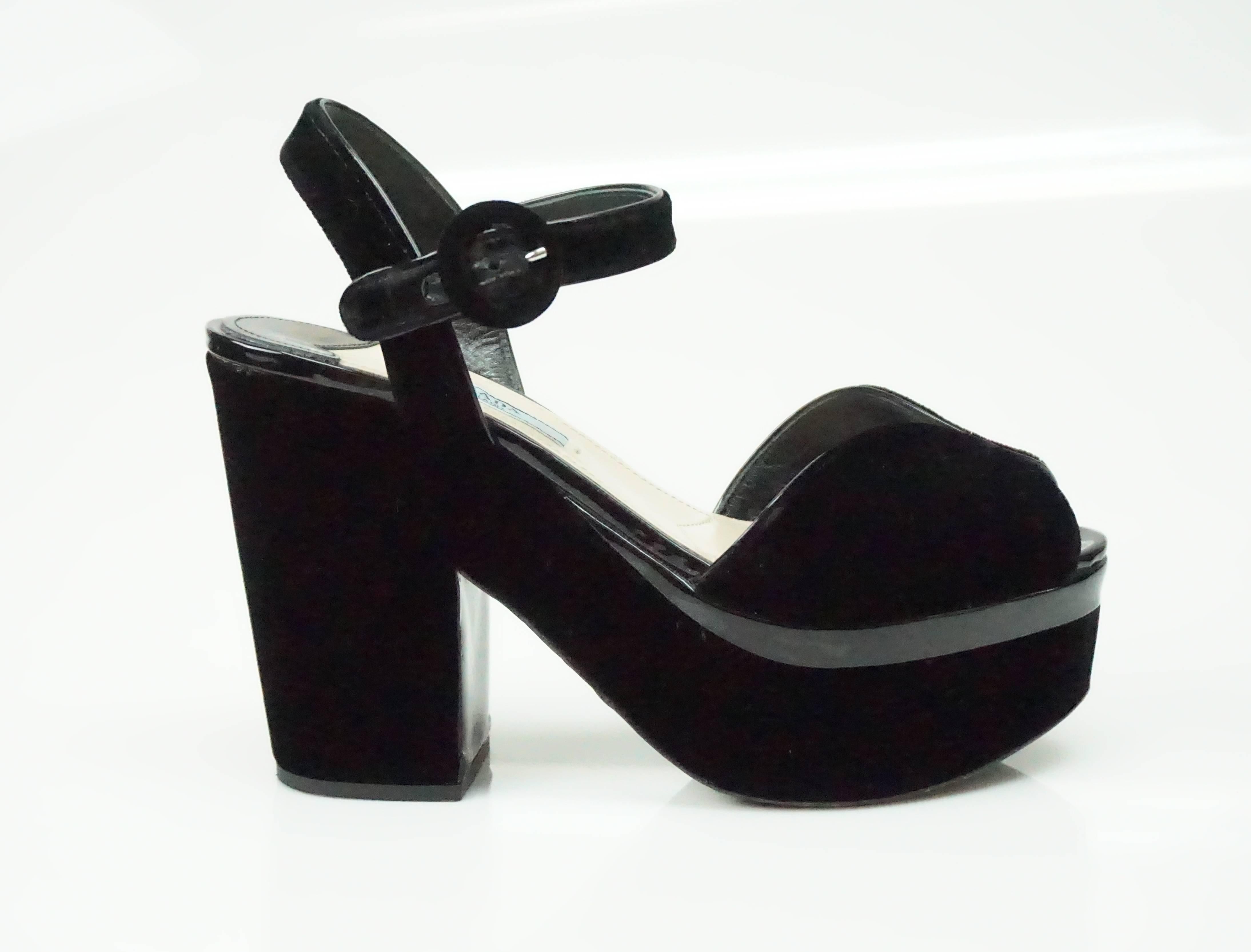 Prada Black Velvet Ankle Strap Platform Heel - 37  These spectacular shoes are in excellent condition.  They have a fabulous chunky heel and are truly so chic. There is some wear towards the sole of the shoe and some scuffing near the toe area.