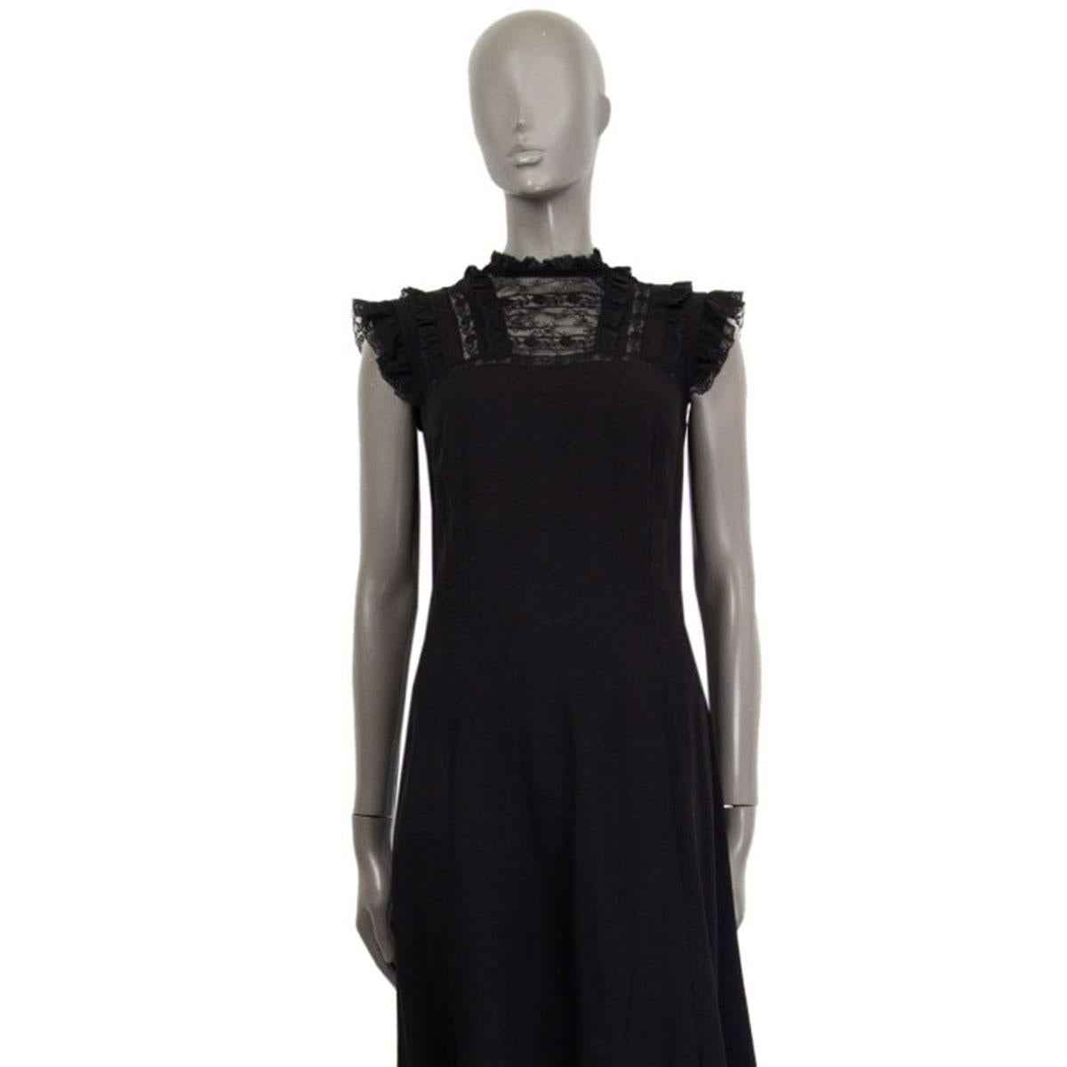 authentic Prada cap sleeve flared dress in black viscose blend (assuming as the content tag is missing) with lace-ruffle and detailed lace-trim at the top and along the hem. Unlined. Closes with a concealed zipper at the back. Has been worn and is