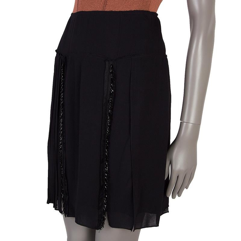 Prada pleated skirt in black viscose (100%). With two lines of beads on the front. Closes with one hook and invisible zipper on the side. Lined in black fabric. Has been worn and is in excellent condition. 

Tag Size 40
Size S
Waist 68cm