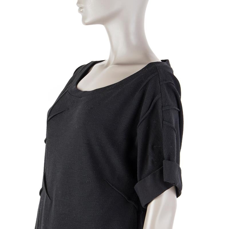 Prada short-sleeve knit dress in black viscose (35%), nylon (35%), virgin wool (25%), and elastane (5%). With wide round neck, decorative inverted darts, and forlded cuffs. Unlined. Has been worn and is in excellent condition.

Tag Size L
Size