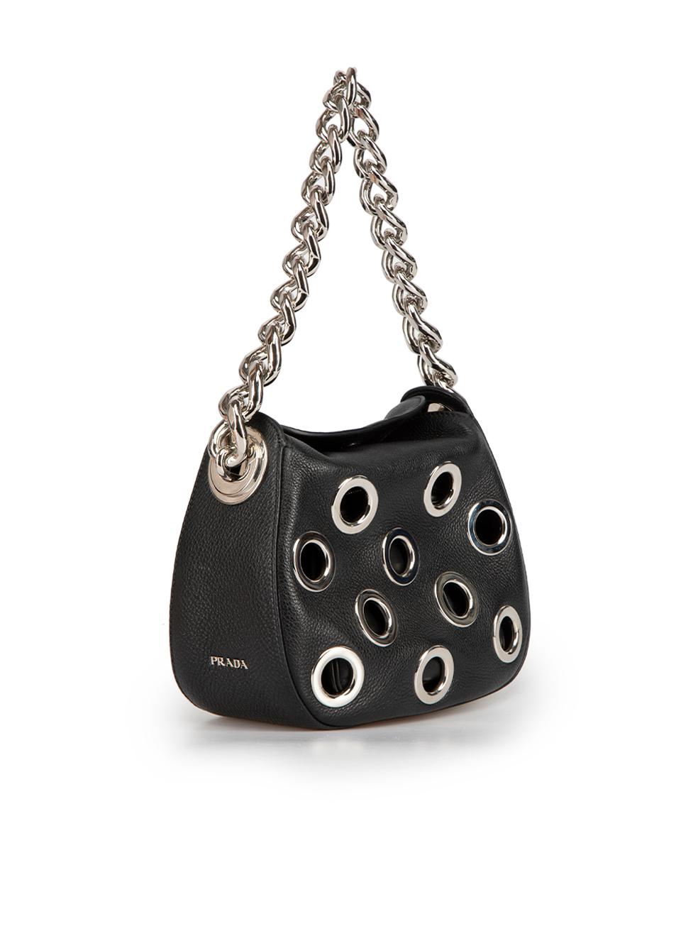 CONDITION is Very good. Hardly any visible wear to bag is evident on this used Prada designer resale item. Comes with original dust bag.
 
Details
Vitello Daino Grommet model
Black
Leather
Mini shoulder bag
Oversized eyelets accent
1x Silver tone