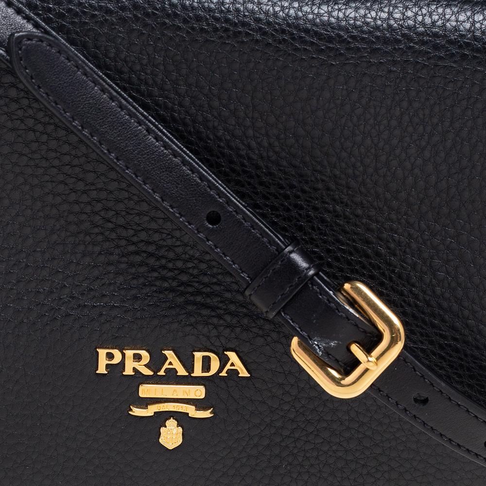 This crossbody bag from the House of Prada is an example of the label’s penchant for creating staple pieces. It is made from black Vitello Daino leather, with a gold-toned logo lettering perched on the front. Along with a spacious leather-fabric