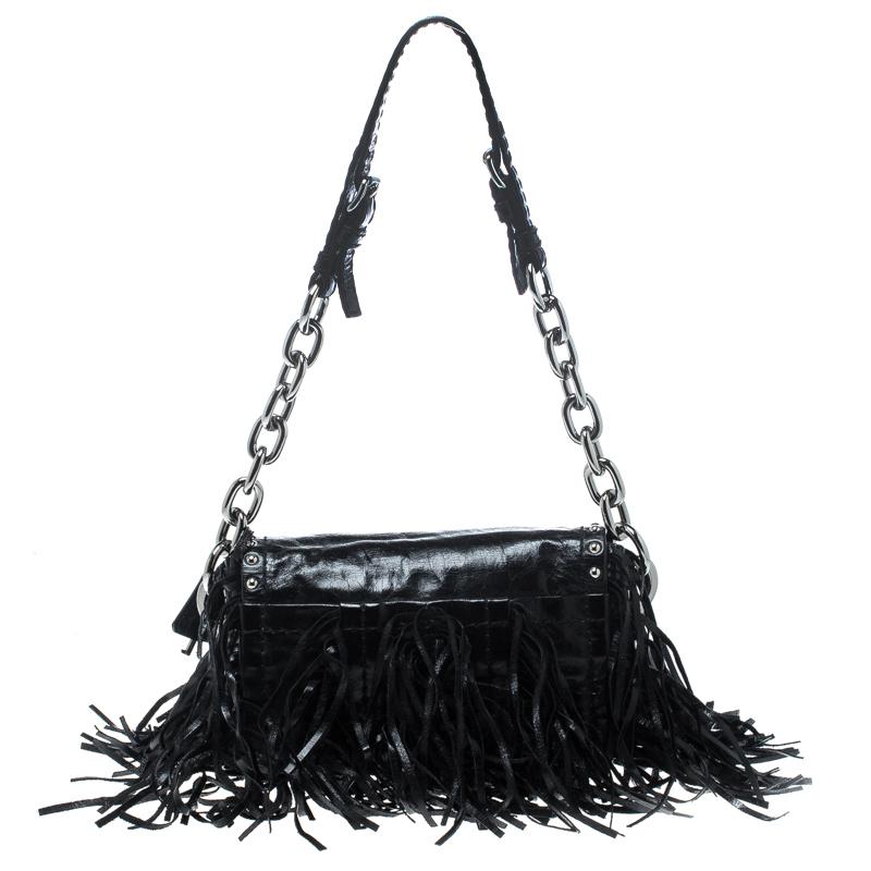 You'll love carrying this stunning Vitello Shine bag from Prada that is sure to grab you a lot of compliments. The black bag is crafted from leather and features a chic silhouette. It flaunts fringe detailing on the exterior and comes with a push