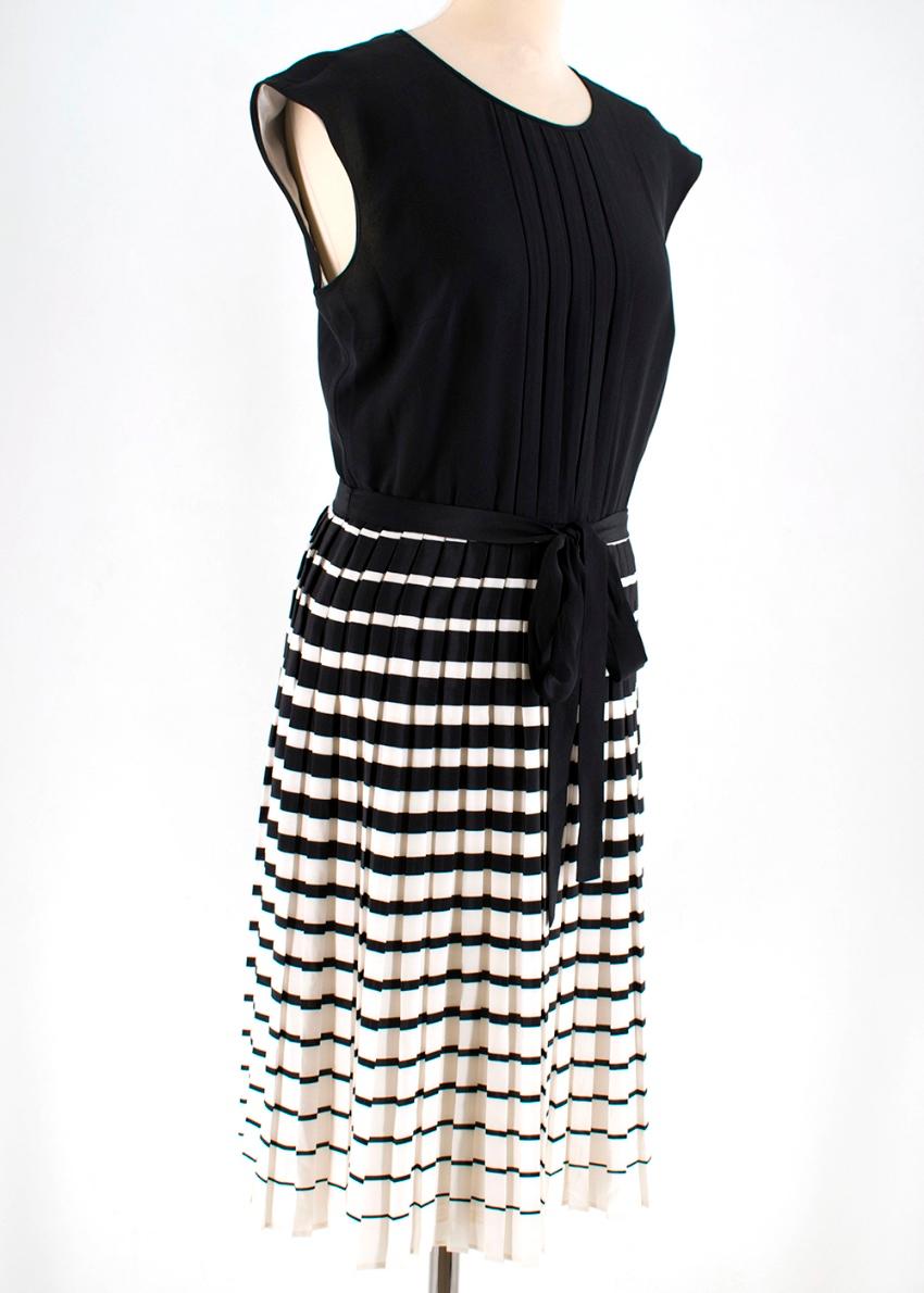 Prada - black and white a-line silk dress. RRP £1800

- round neck
- self tie neck detail
- keyhole cut out at the back 
- self tie belt at the waist
- striped pleated skirt 
- pleated chest
- light weight 
- fully lined
- sleeveless
- zip fastening