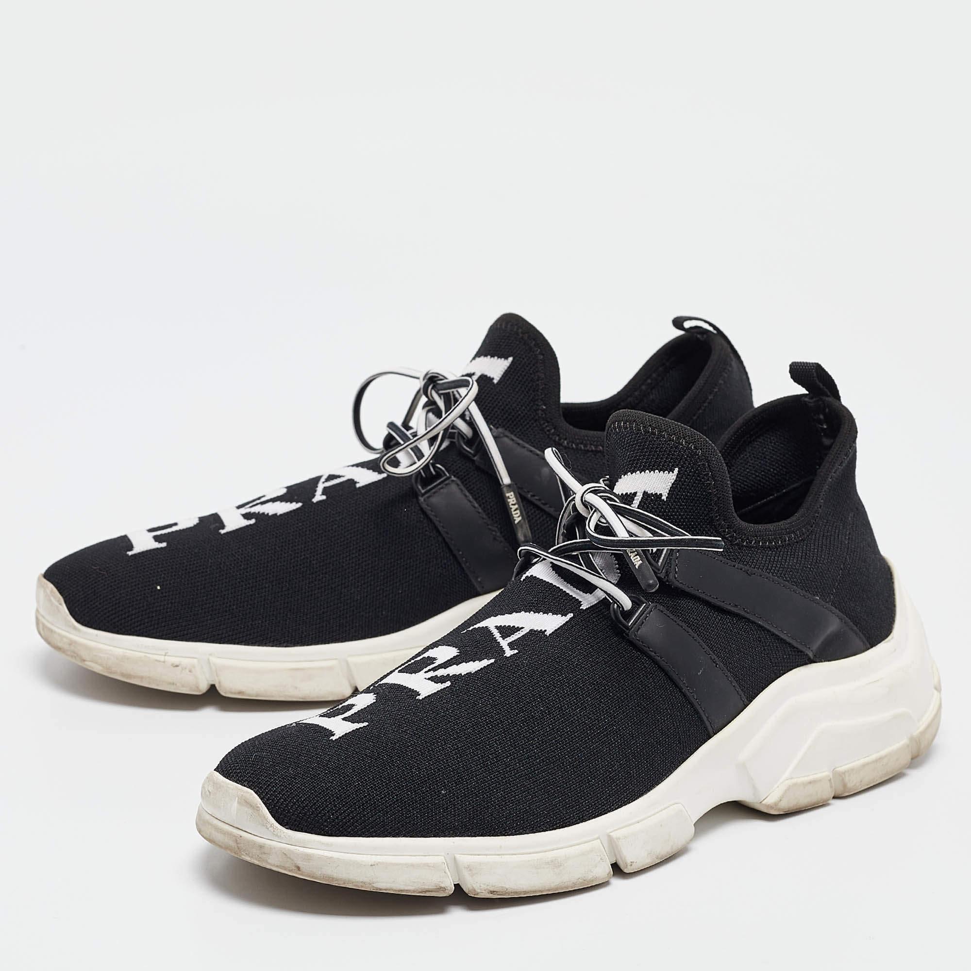 Crafted with skill these Prada black sneakers feature a luxe design with signature detailing. You can count on them to elevate any outfit. Embrace the ultimate in sophistication and comfort with every step you take.