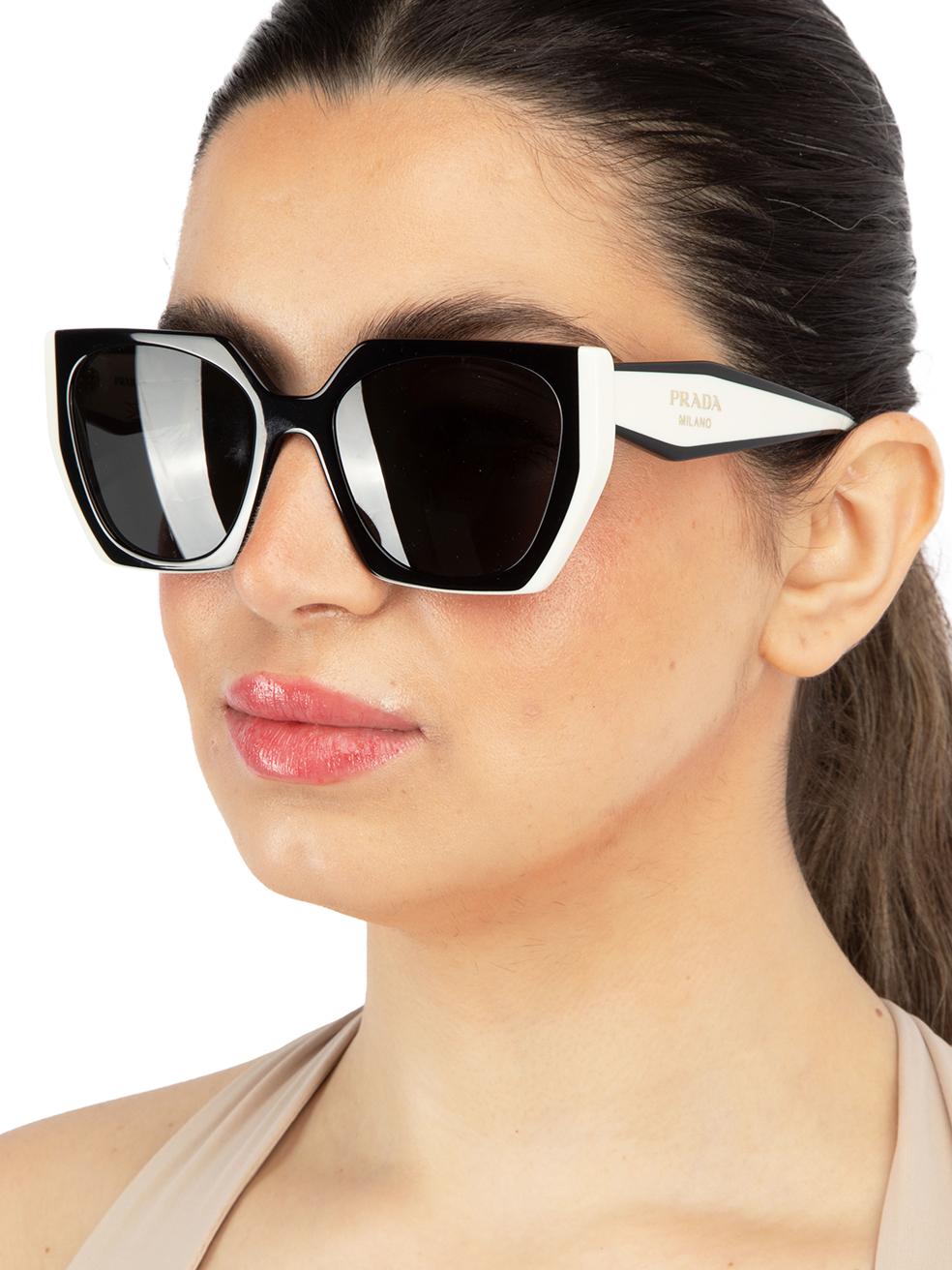 CONDITION is New with tags on this brand new Pradadesigner item. This item comes with original packaging.
  
  Details
  Model: PR15WS
  Black and white
  Acetate
  Rectangular Eye Sunglasses
  Monochrome accent
  Tinted Dark Grey Lens
  Branding at