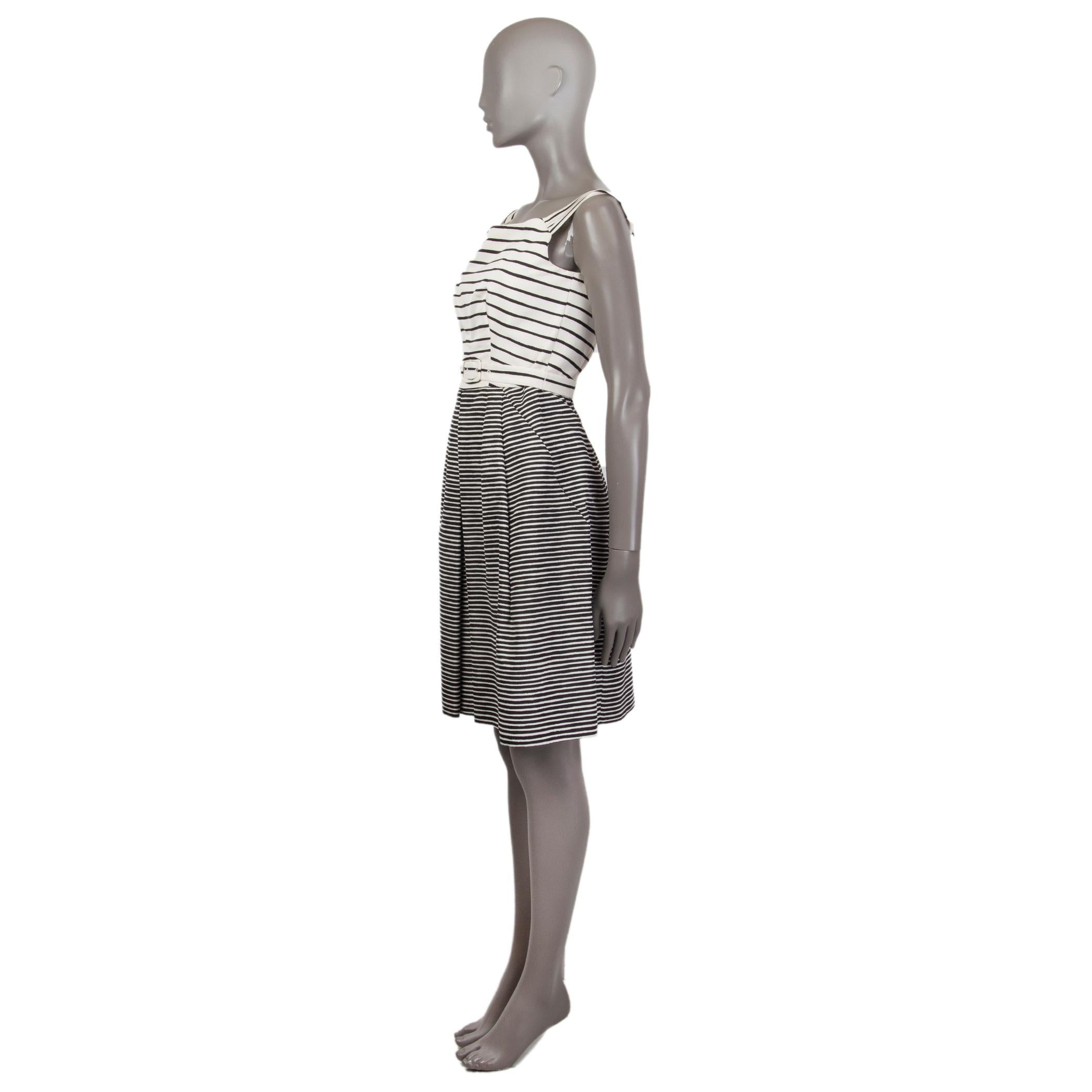 Prada sleeveless striped cocktail dress in off-white and black silk (100%) with a square neck. Closes on the back with a concealed zipper. Has side pockets. Comes with a matching belt. Lined in viscose (66%) and silk (34%). Has been worn and is in