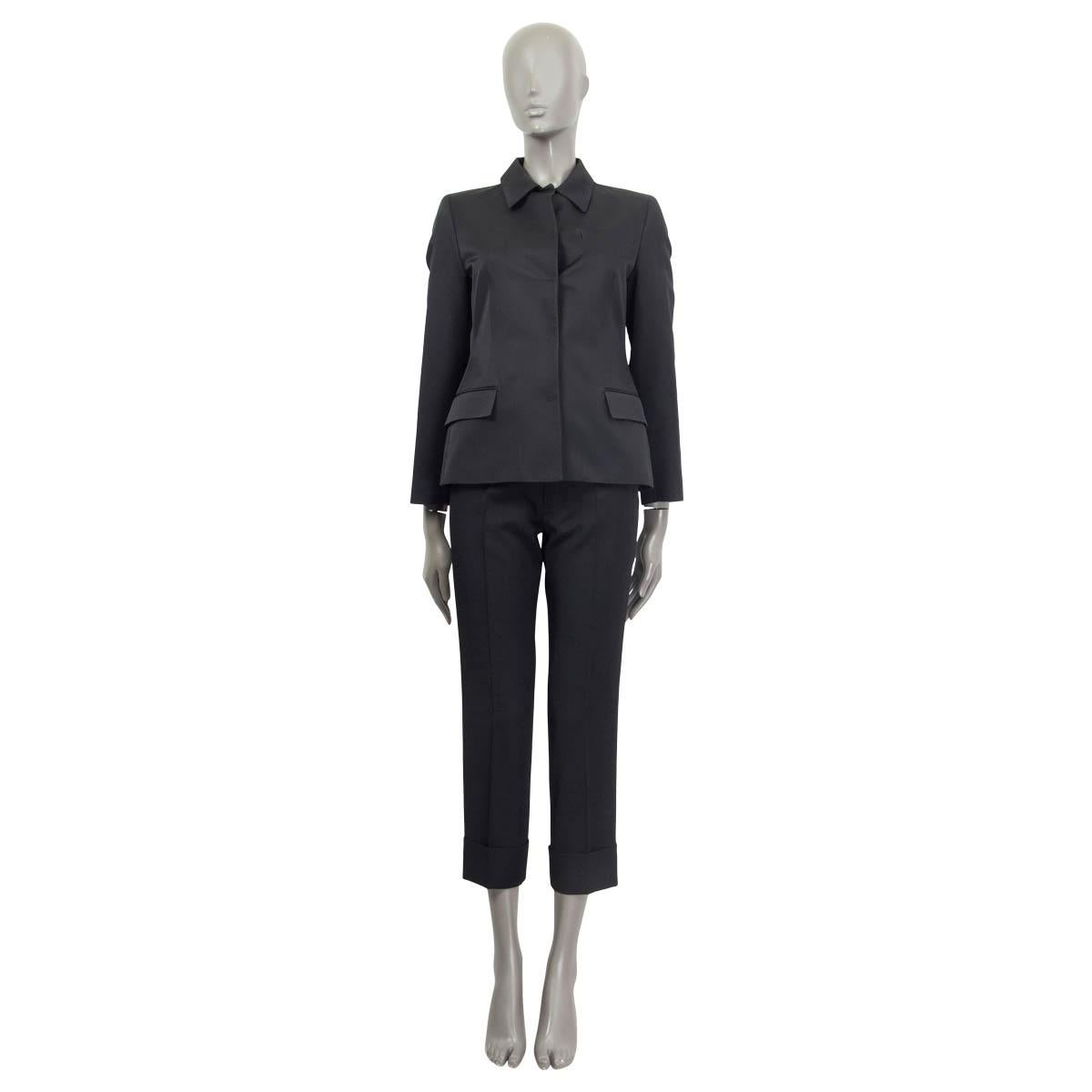 100% authentic Prada classic blazer in black wool (52%) and silk (48%). Features two flap pockets on the front. Opens with five push buttons on the front. Lined in black rayon (100%). Has been worn and is in excellent condition.

Measurements
Tag