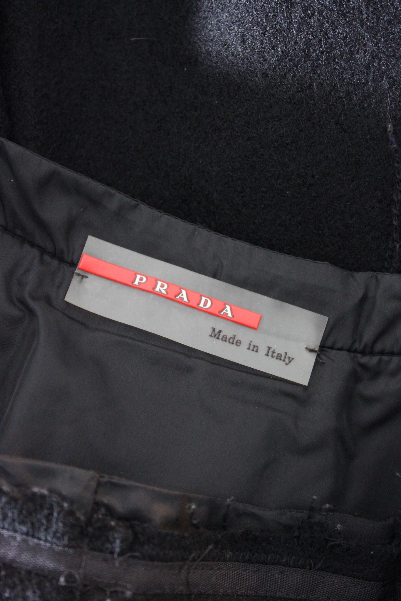 Prada 2000s vintage flared skirt. Black color, side zip closure and small bow, slit on the front. Fabric 80% wool, 20% mohair, internally lined. Made in Italy.

Size: 40 It 6 Us 8 Uk

Waist: 39cm
Length: 60cm