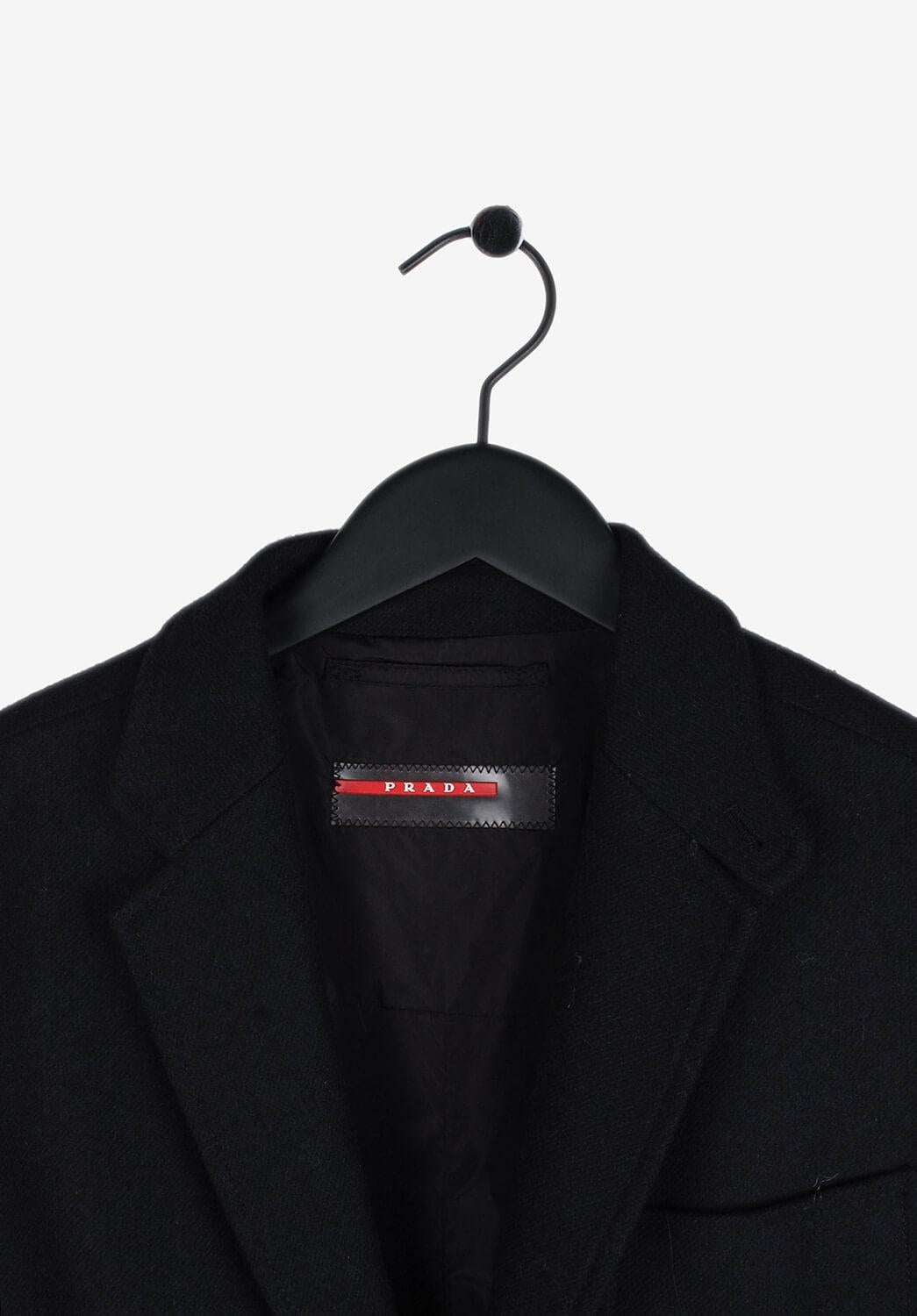 Item for sale is 100% genuine Prada Blazer Style Wool Men Jacket (S010)
Color: Navy
(An actual color may a bit vary due to individual computer screen interpretation)
Material: 100% wool
Tag size: 52IT(L) 
This coat is great quality item. Rate 9 of