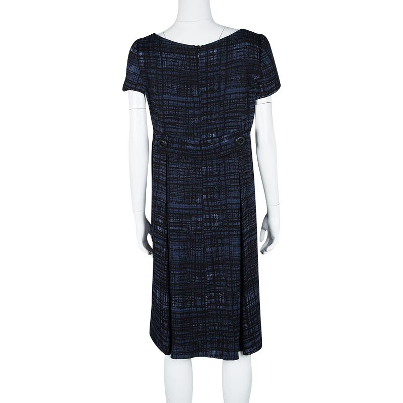 This is one dress that you can wear to work or at parties. It is a Prada creation that has been made using the finest materials and styled with short sleeves and a hem that ends just below the knees. This dress will look great with glossy pumps.


