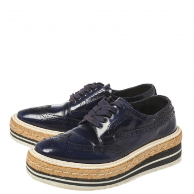 How can one not be in awe by just looking at this luxe pair from Prada! These derby sneakers are well-crafted from blue-hued leather and they are beautified with lace-ups and brogue detailing. Comfortable insoles and espadrille platforms complete