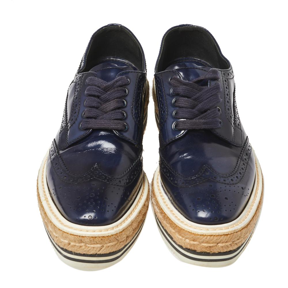 How can one not be in awe by just looking at this luxe pair from Prada! These derby sneakers are well-crafted from blue-hued leather and they are beautified with lace-ups and brogue detailing. Comfortable insoles and espadrille platforms complete