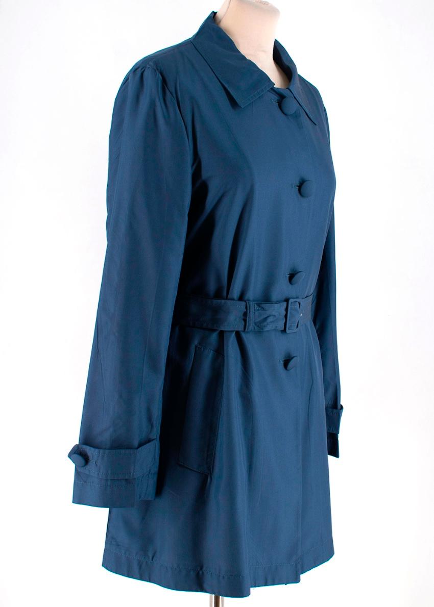 Prada Blue Button Down Light Weight Silk Jacket 

- Belt included with Buckle Fastening 
- Front Button Down Fastening 
- Pointed Collar 
- Side Slip Pockets 
- Pleated Back 
- Straight Hemline 

Materials 
100% Silk
Lining
100% Viscose 

Dry Clean