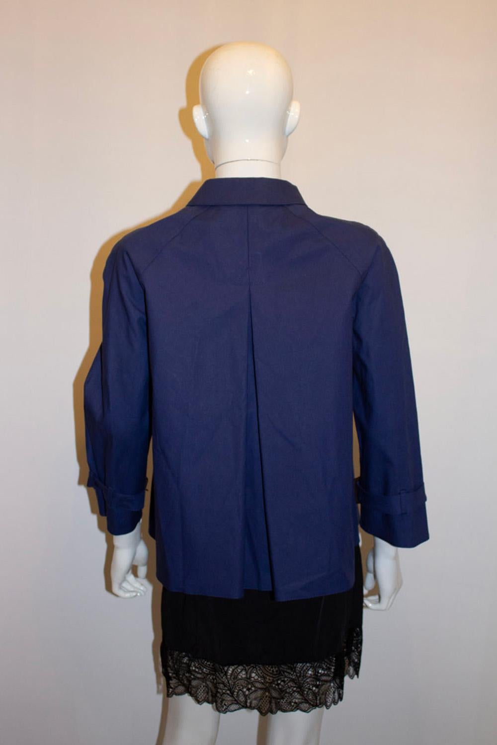 A fun, chic and useful jacket by Prada, Art number 280951. The jacket is 100 % cotton , with a button front and belt around the cuffs. It  has an A line vent at the back and is unlined. Measurements:
Bust up to 40'', length 25''