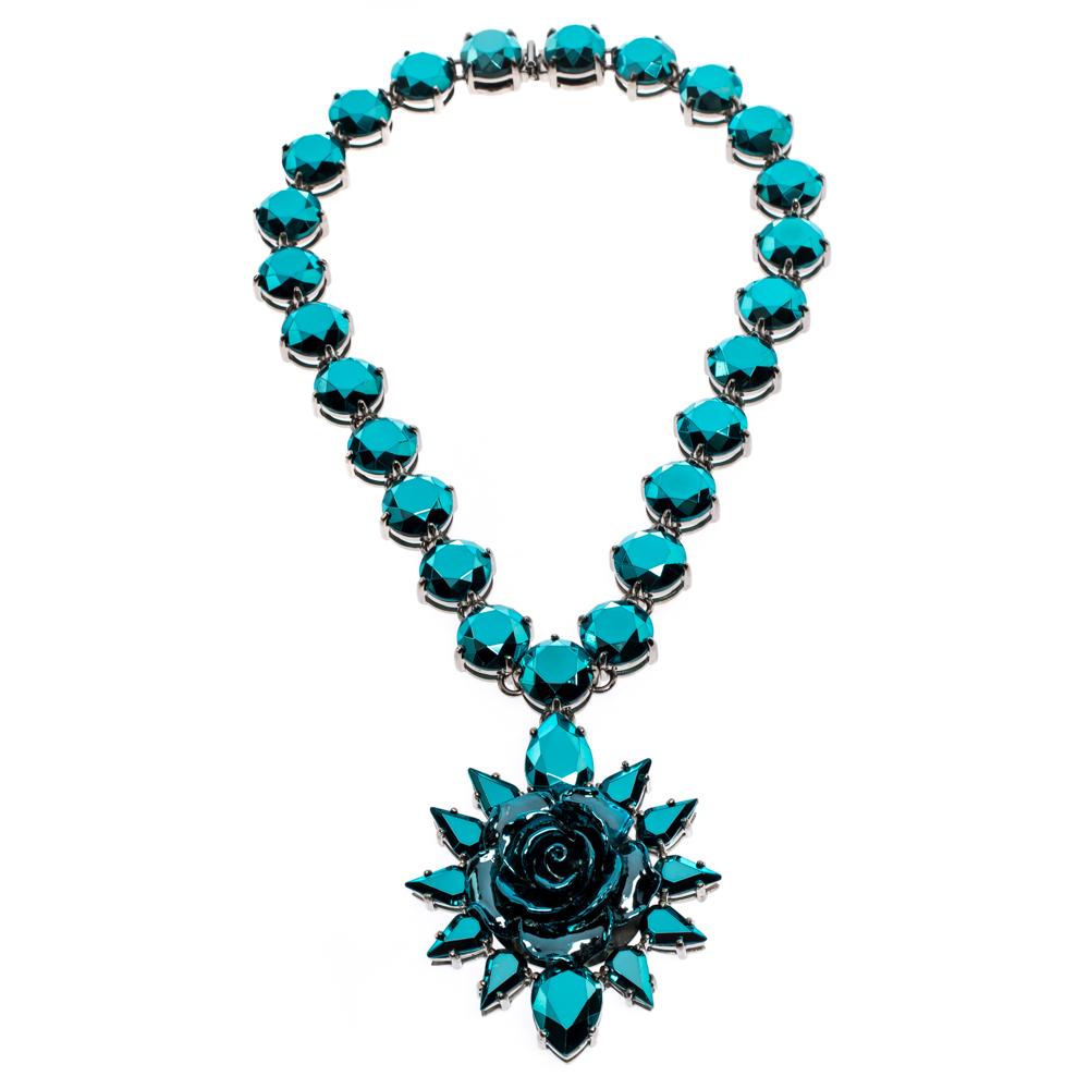 Accessories that are high on style are absolutely worth the buy, such as this necklace by Prada. It has been so well assembled with blue crystals while being held by a silver-tone chain-link. The embellishments are breathtaking and they elevate the