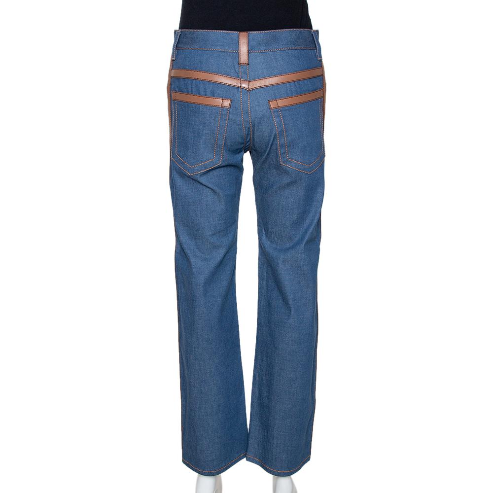 This stylish and chic pair by Prada will make sure your casual ensembles are on point every time. Crafted from quality denim, they come in a lovely shade of blue. They are cut to deliver a straight leg fit and are further detailed with leather