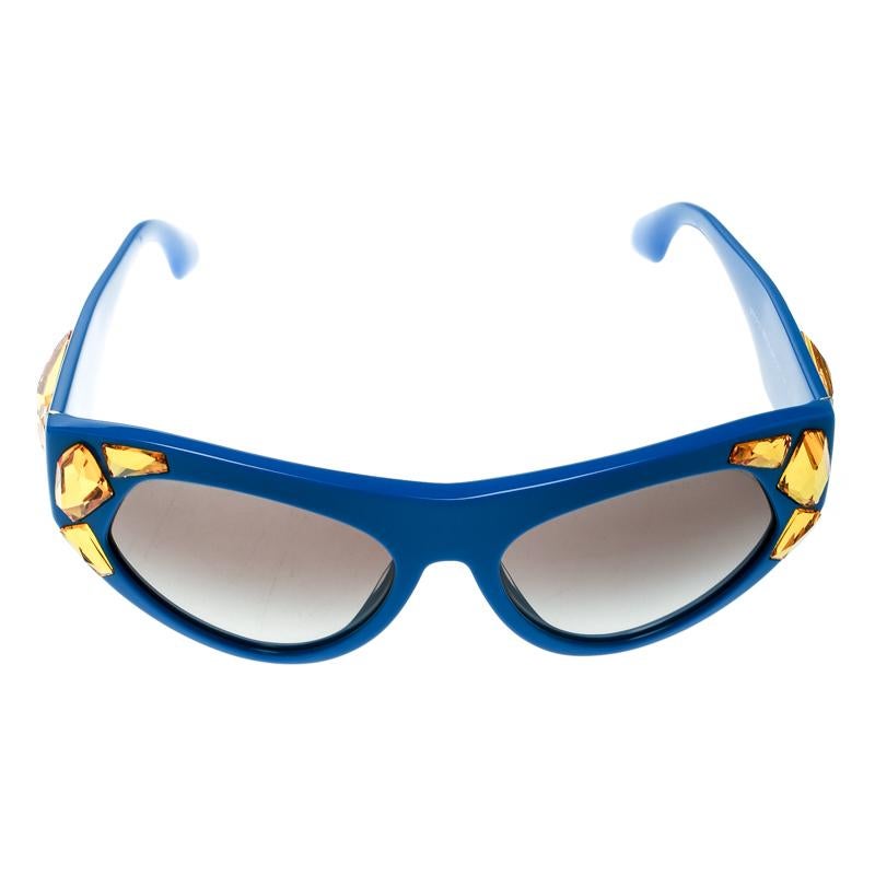 Don't limit your fashion sense to just your clothes and shoes but let your accessories also help you make the right style statement. Choose creations like these sunglasses from Prada to do just that for you. Flaunting cat eye edges and crystals,