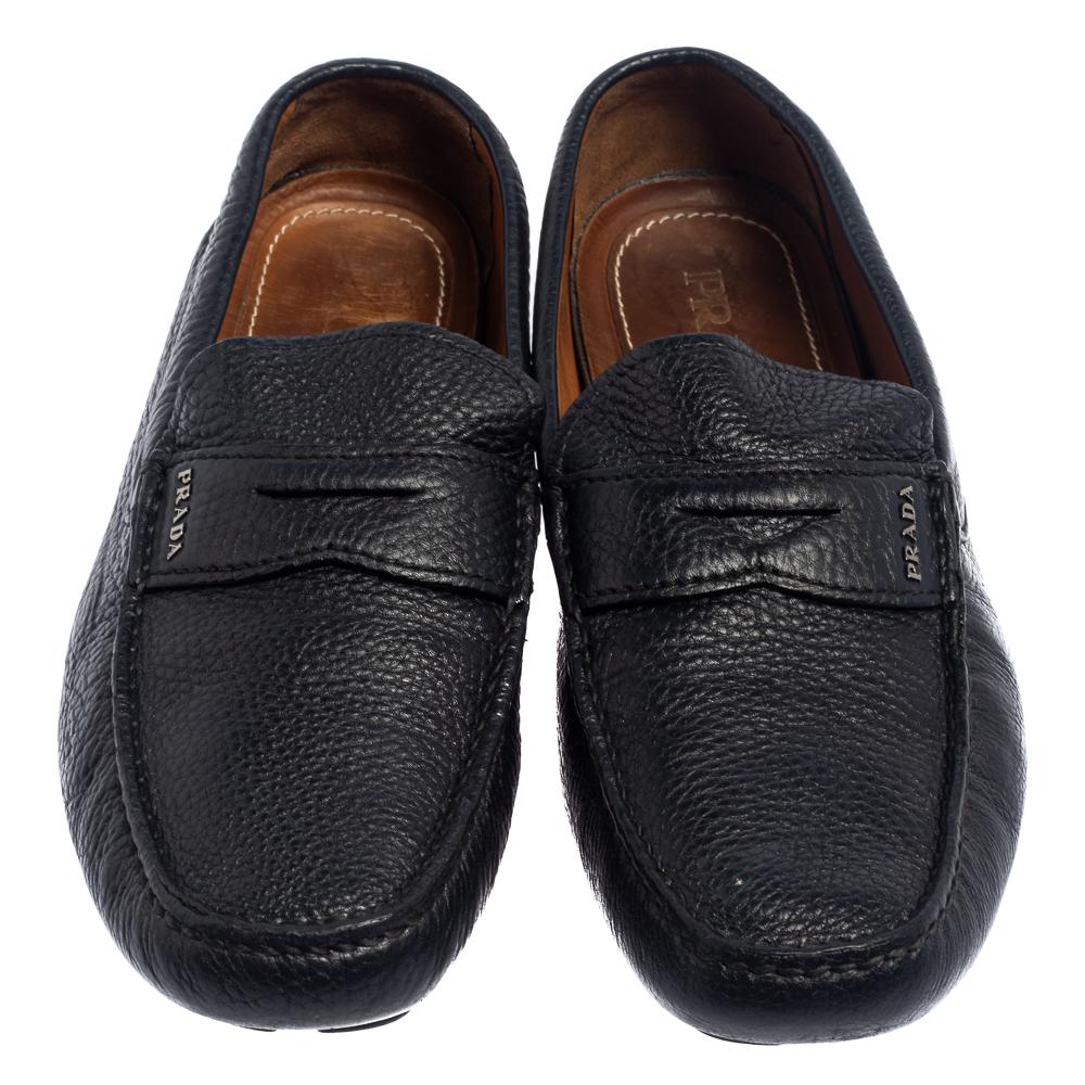 Stylish and super comfortable, this pair of loafers by Prada will make a great addition to your shoe collection. They have been crafted from quality leather and styled with logo detailing in silver-tone on the penny straps. Leather insoles and