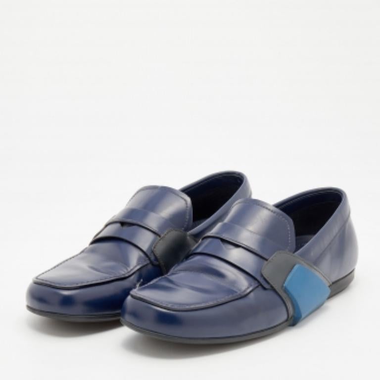 Walk stylishly and comfortably in these loafers from the House of Prada. They are fashioned in blue leather on the exterior and showcase an easy slip-on style. Wear these loafers with your formal outfit and look classy.