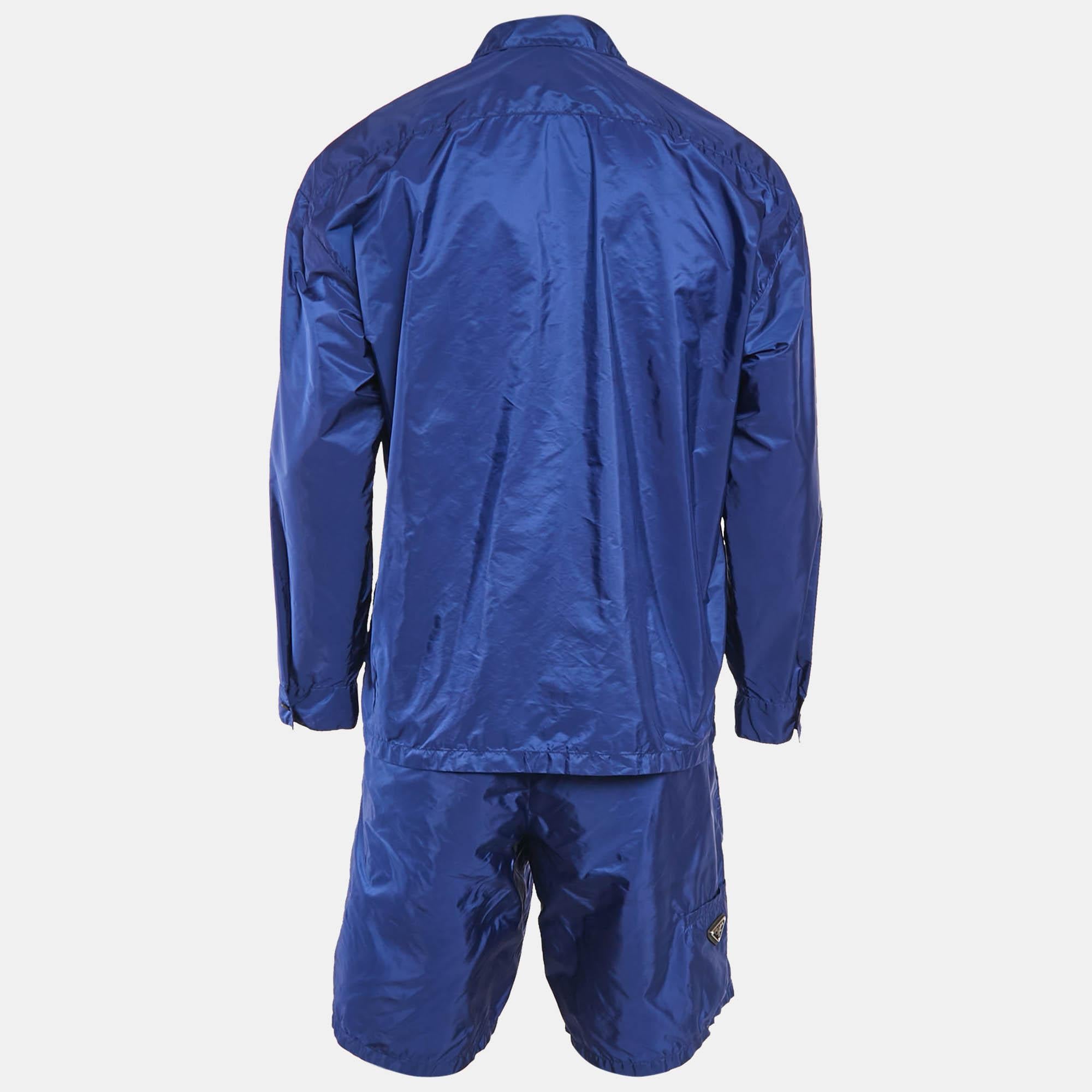 Discover the Prada set  a perfect blend of style and sustainability. Crafted from innovative Re Nylon fabric  this set features a striking blue logo triangle design that adds a modern touch. The relaxed fit ensures comfort  making it an ideal choice