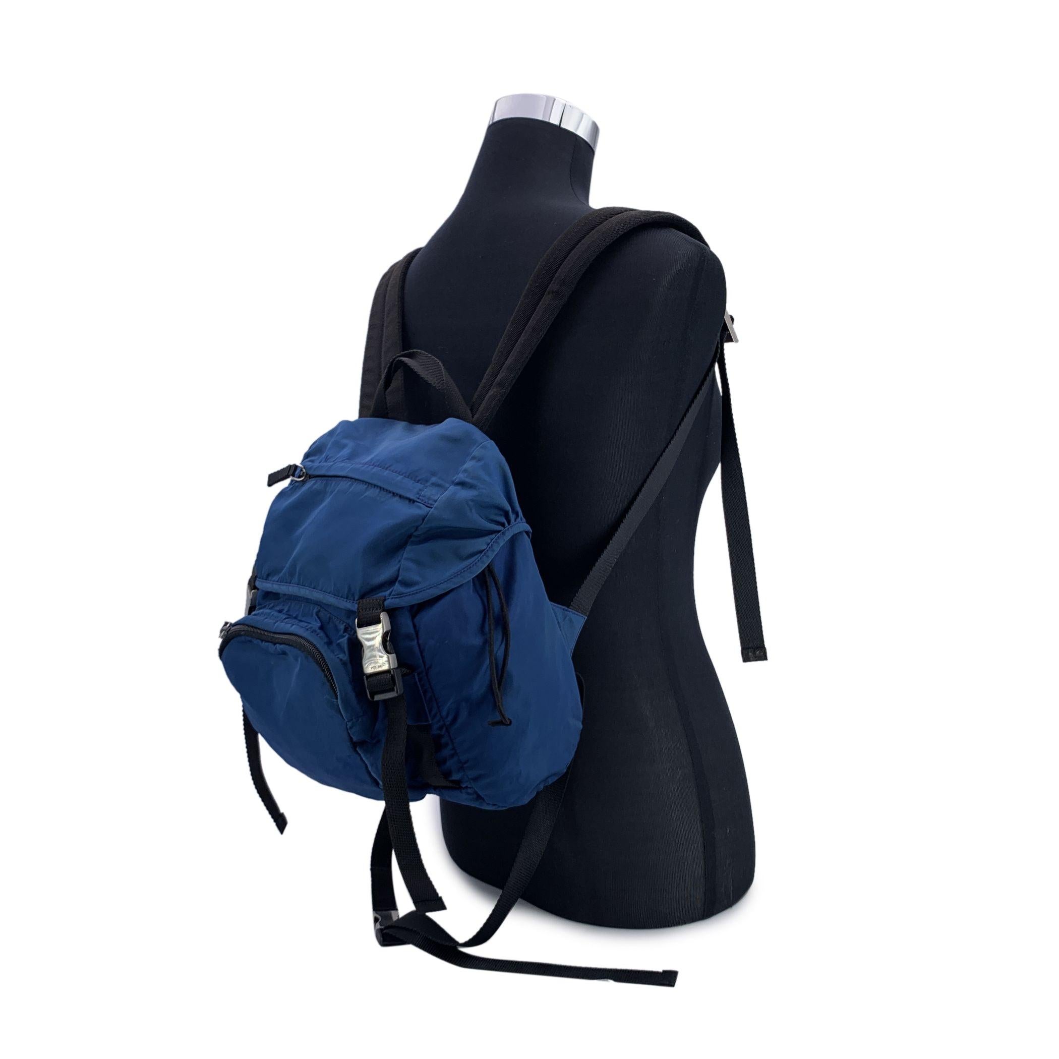 This beautiful Bag will come with a certificate of authenticity provided by third party authenticators. The certificate will be provided at no further cost Unisex Backpack by Prada, crafted of nylon canvas in blue color. The bag features 2 exterior