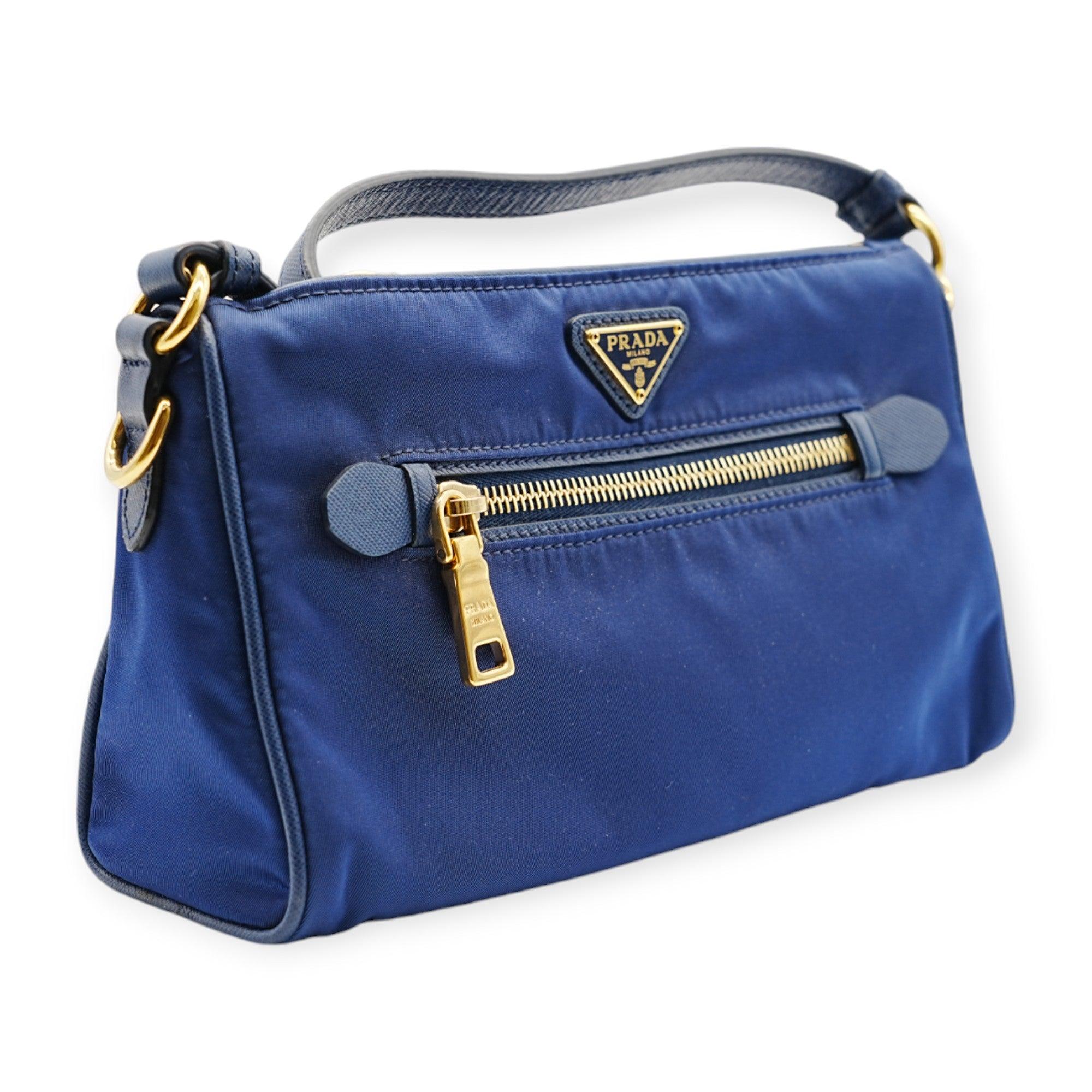 The Prada Blue Nylon Shoulder Bag features a minimalist design in vibrant blue nylon. Lightweight and functional, it’s perfect for adding a pop of color and modern style to everyday ensembles.
 Inclusion: Dustbag, instruction paper
 Remarks: Overall